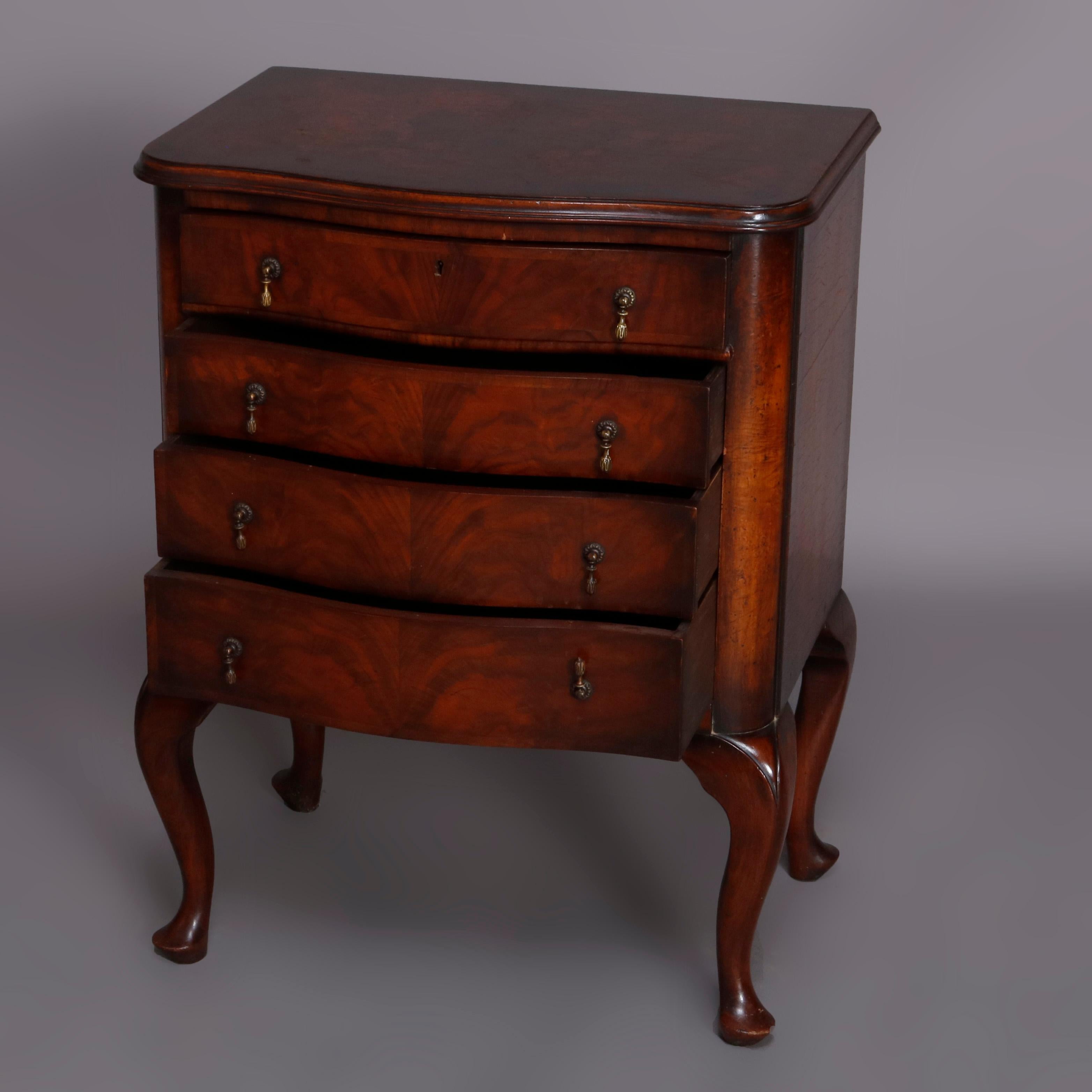 A vintage Queen Anne style mahogany side stand offers serpentine form with case having four bookmatched flame mahogany drawers and shaped skirt, raised on cabriole legs terminating in pad feet, cast bronze drop pulls throughout, 20th
