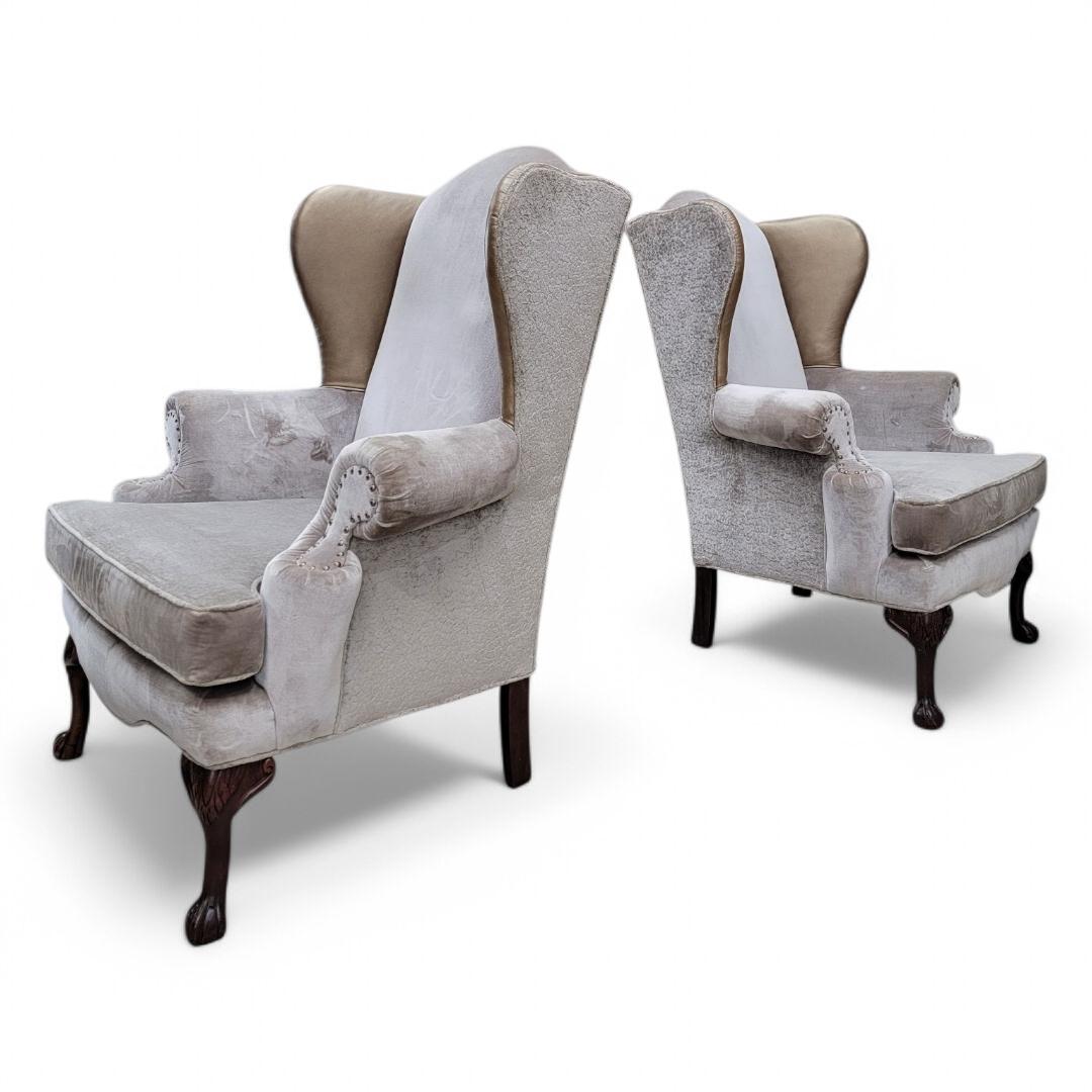 Vintage Queen Anne Style Wingback Lounge Chairs in Velvet & Chenille and Leather- Pair

Featuring a pair of Queen Anne Style lounge chairs with solid wood wingback frames, carved legs and upholstered armrest detailed with nail head trim.

The chairs