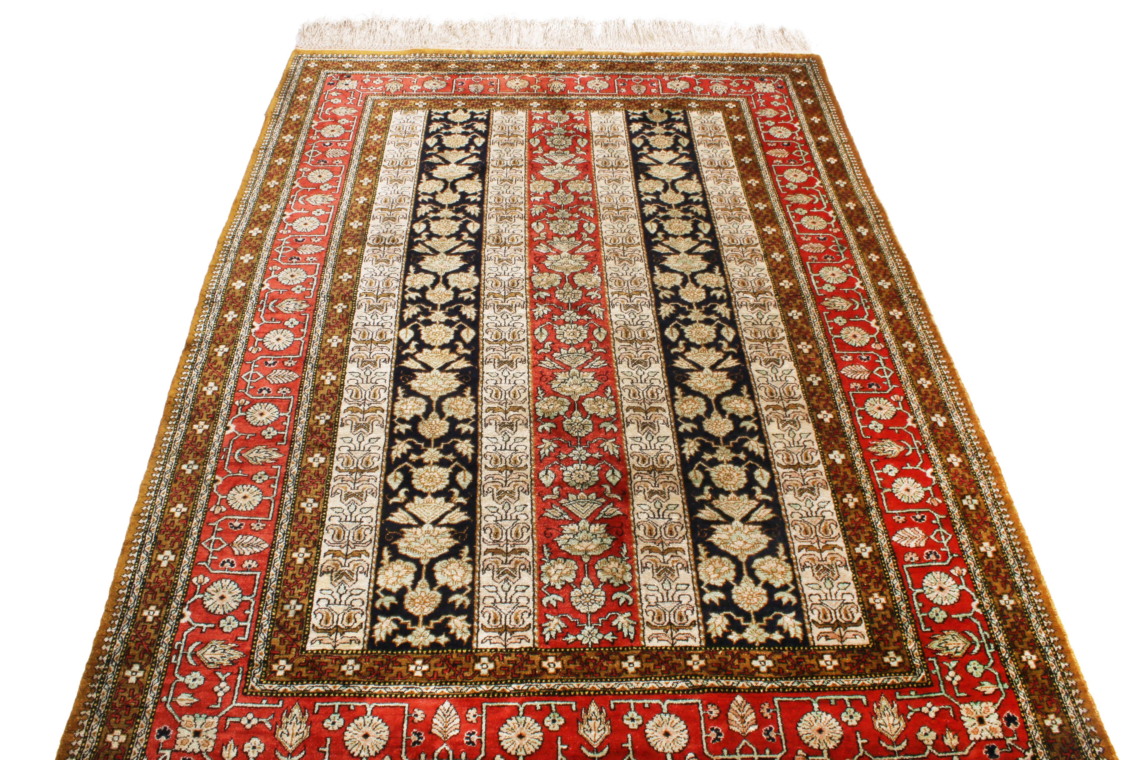 Originating from Persia between 1930-1950, this vintage Persian rug enjoys a unique Qum design with a series of intricate borders and column-based floral imagery complementary to its inviting size. Hand knotted in a soft, luminous silk, the sole