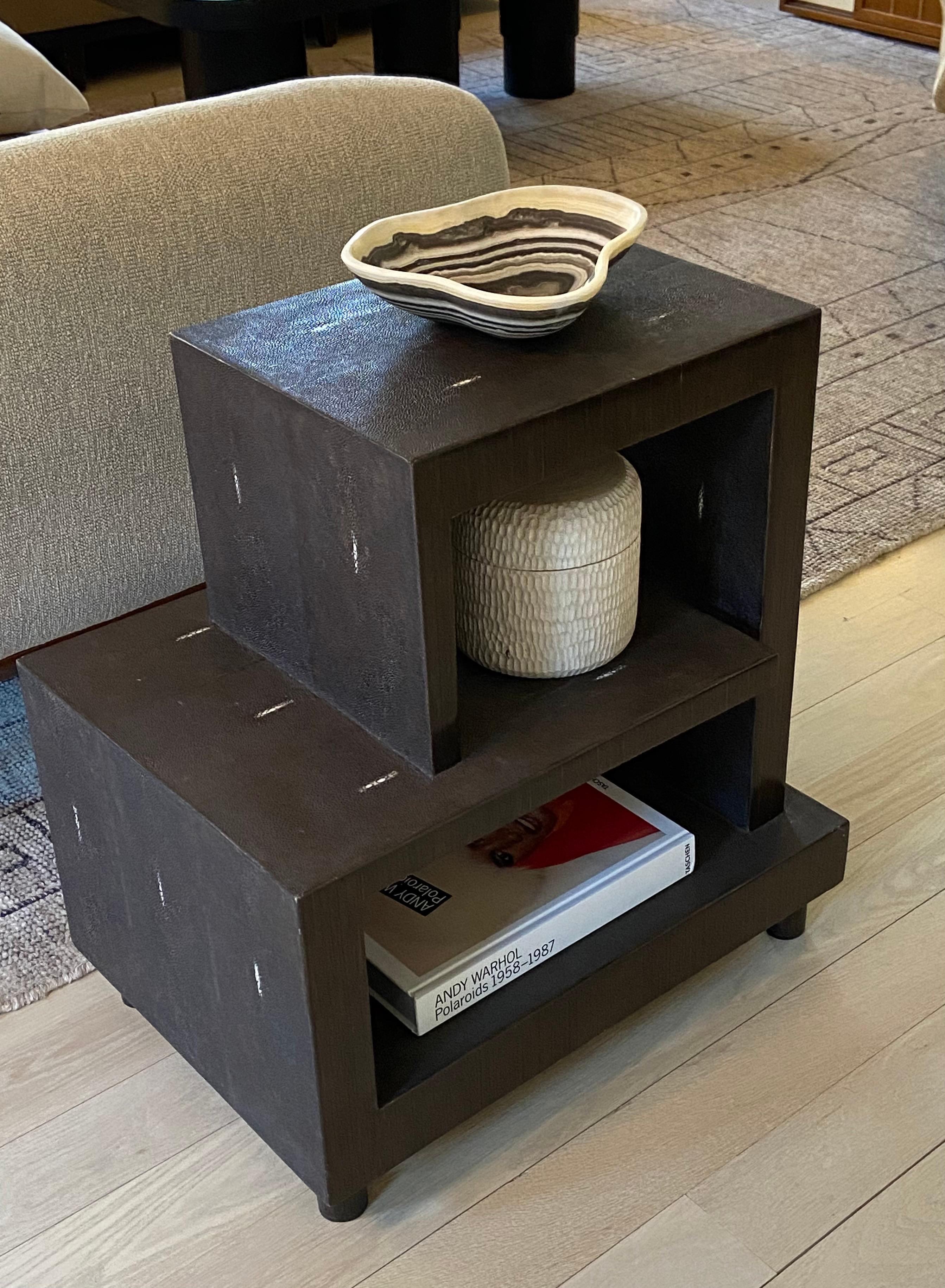 A beautiful and functional vintage R & Y Augousti deco style side table covered in real shagreen. This dark brown side table has a lot of functional usability for being on the smaller side. It has 3 surfaces for display or storage. The brown