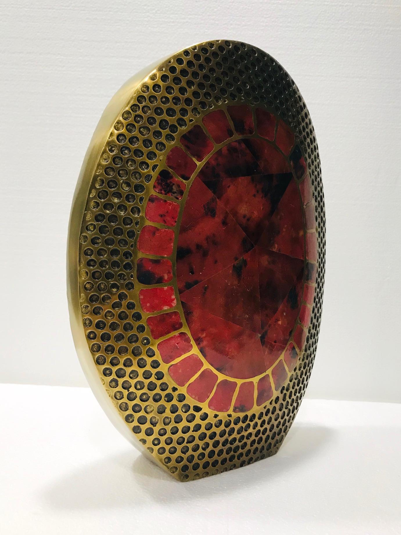 Large organic modern vase handcrafted in solid bronze metal with inlays of exotic pen shell. Heavy-set oval frame in textured bronze features a series of hammered circles reminiscent of reptile or snake scales. The mosaic centers on either side of