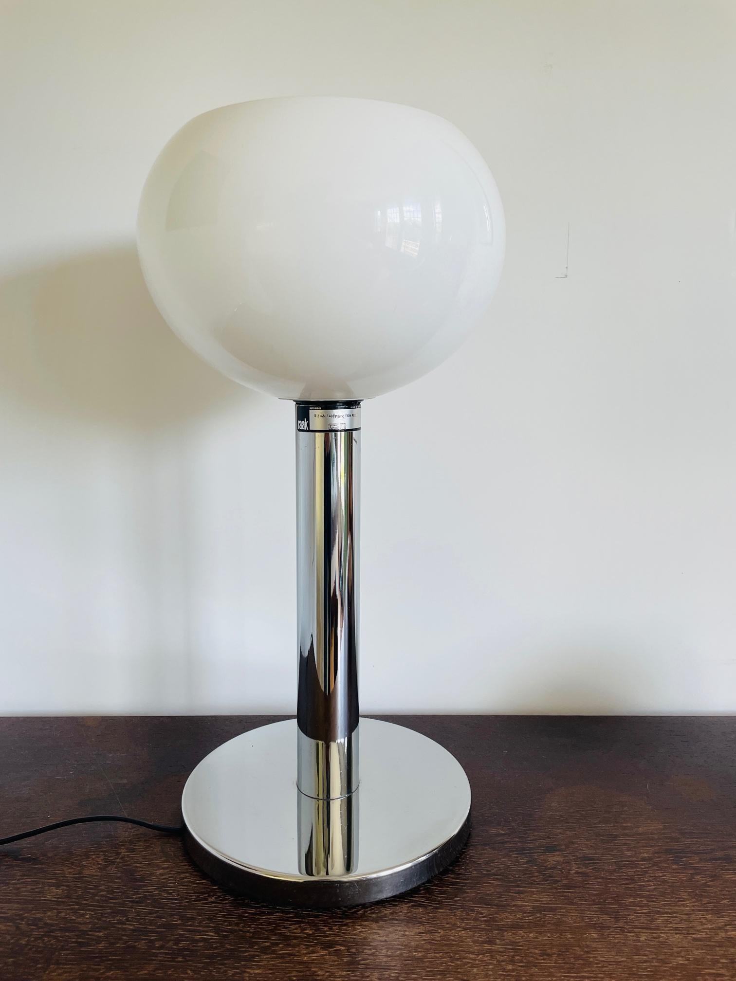 Beautiful large and rare vintage RAAK lamp. 
Made in the 1970's and in absolute stunning condition. 
As well the shade as the base looks as new. 
The 57 cm high lamp is en eyecatcher for every interior. 
From office to living room and from
