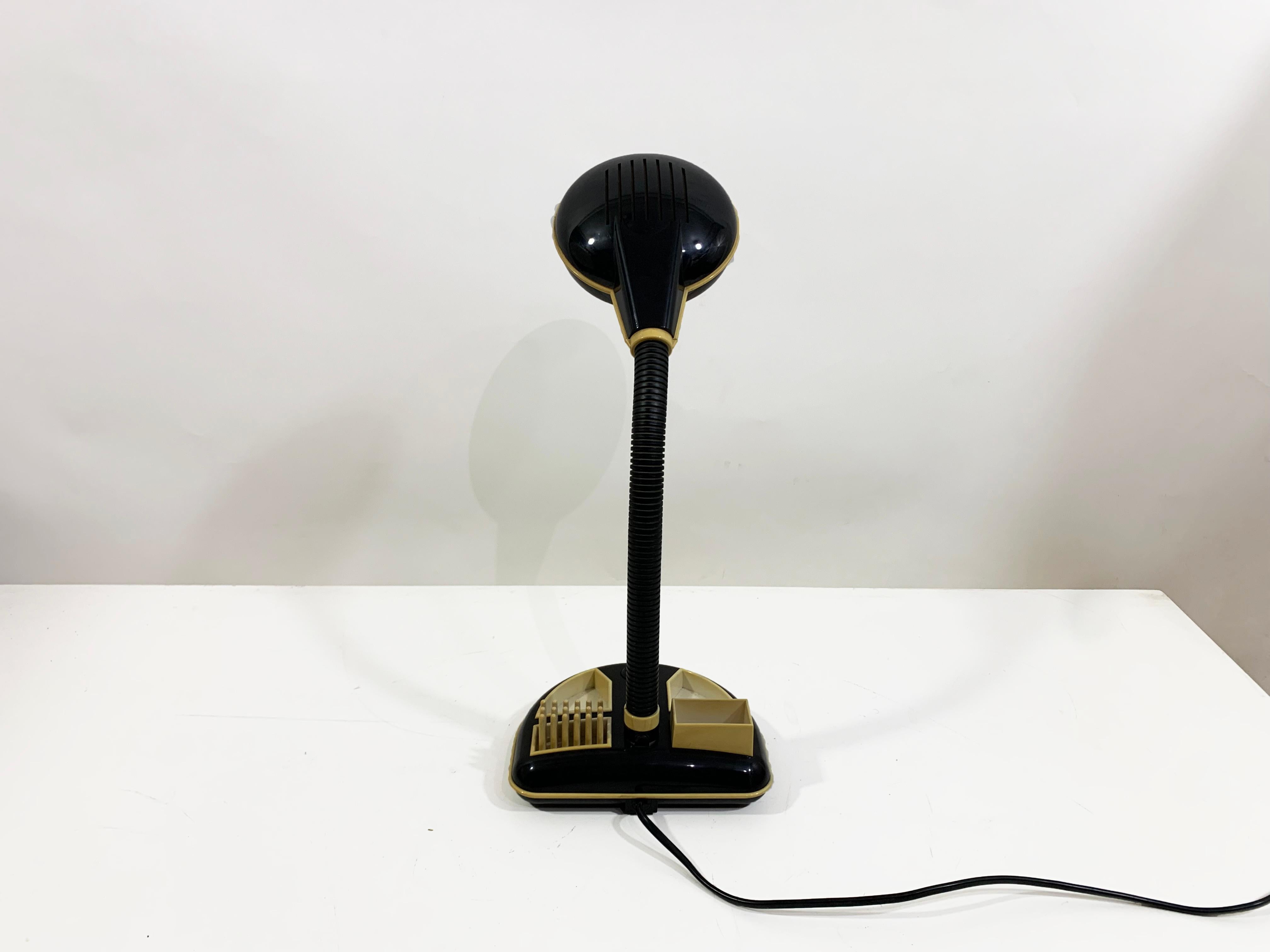 Vintage Design icon piece by Kyoji Tanaka, the Rabbit Tanaka corp lamp is a super fun desk lamp in function and sold without the bulb. 
Having an organiser compartment at its base, it is great for holding paper clips and push pins, a few papers,