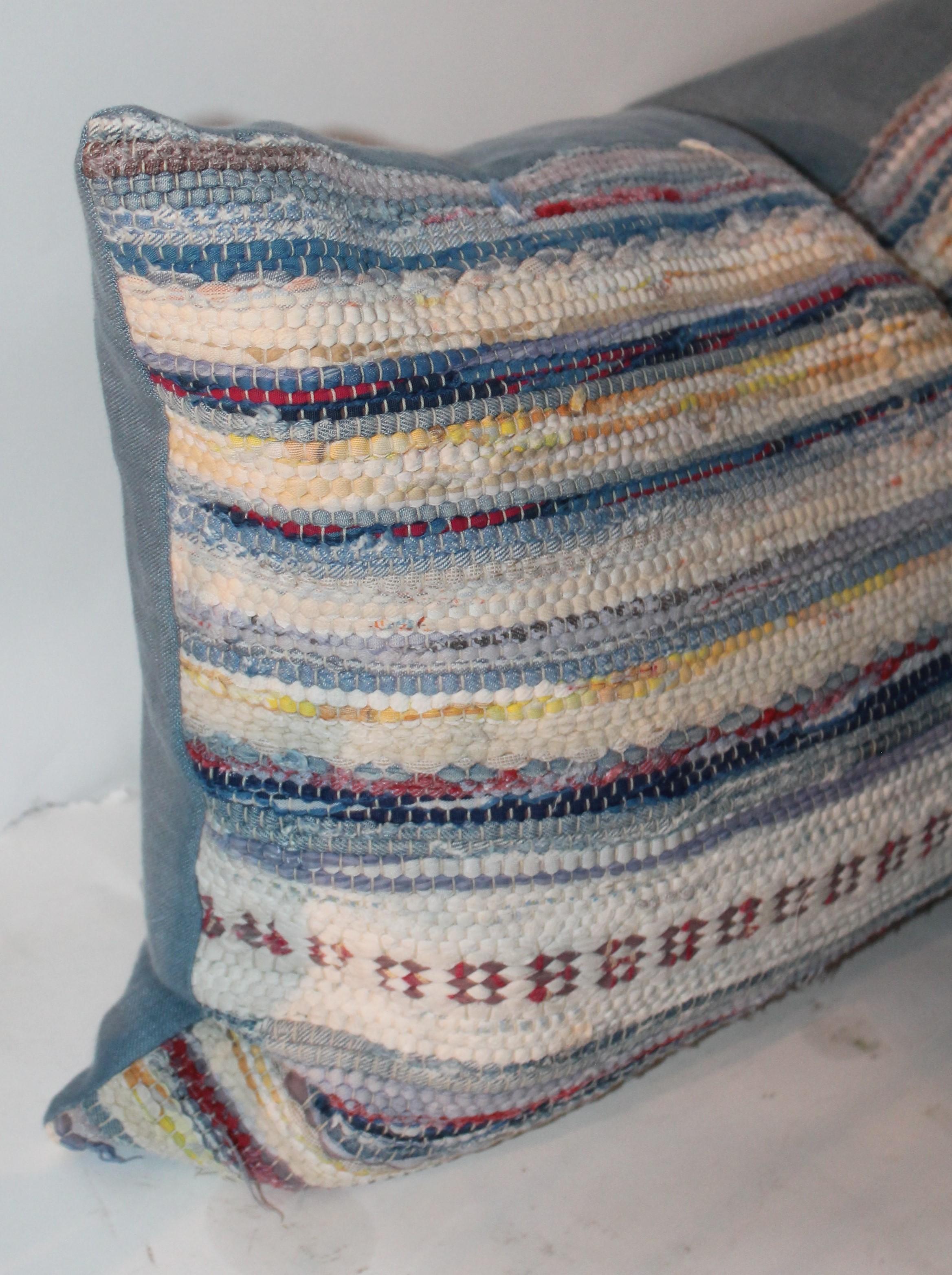 These vintage rag rug pillows have a robin egg blue cotton linen backings. The condition of these bolster pillows are mint condition.