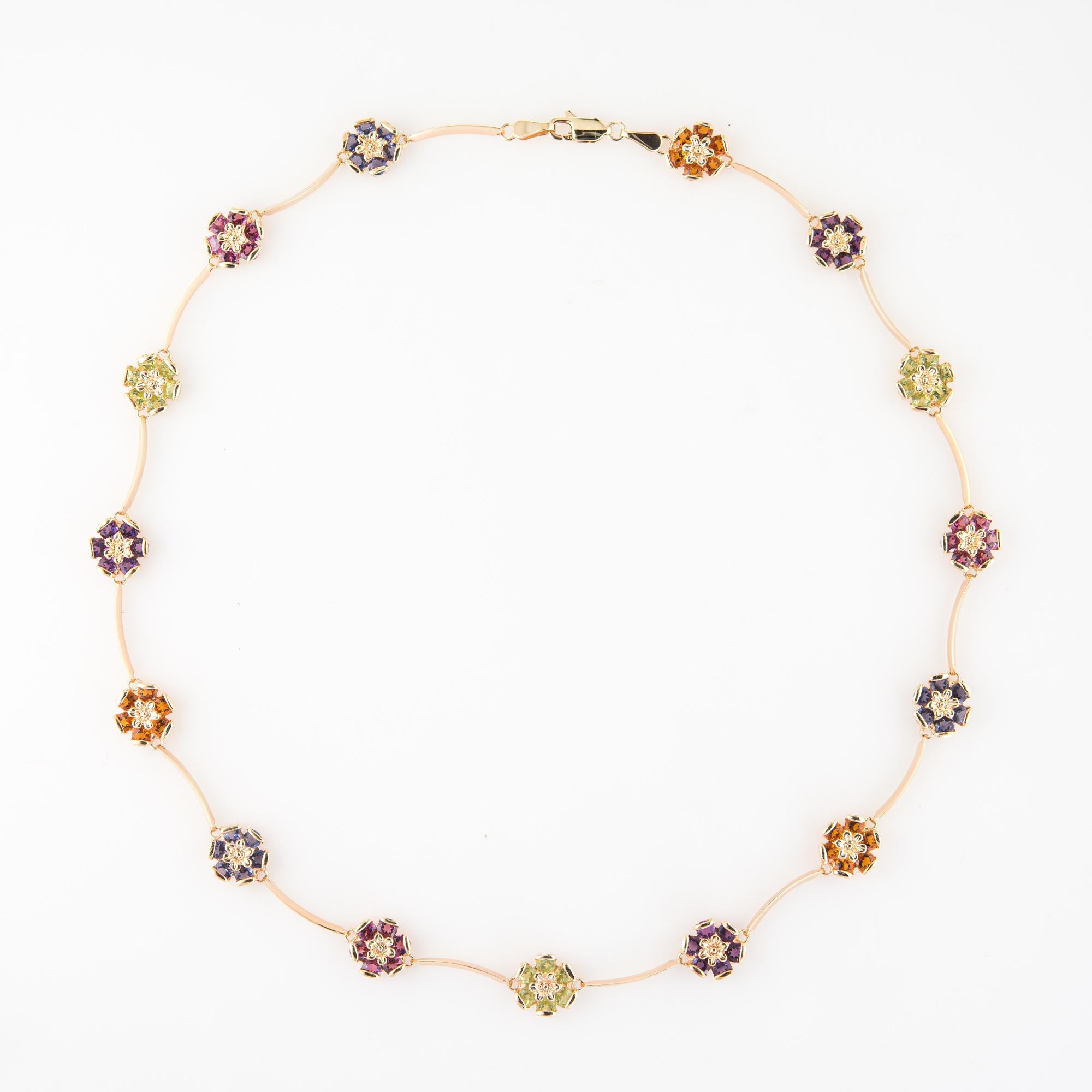 Elegant and finely detailed vintage multi gemstone necklace, crafted in 14 karat yellow gold.  

Iolite, citrine, pink tourmaline, peridot & amethyst are set into flower clusters. Each of the stones is estimated at 0.10  carats (total weight is