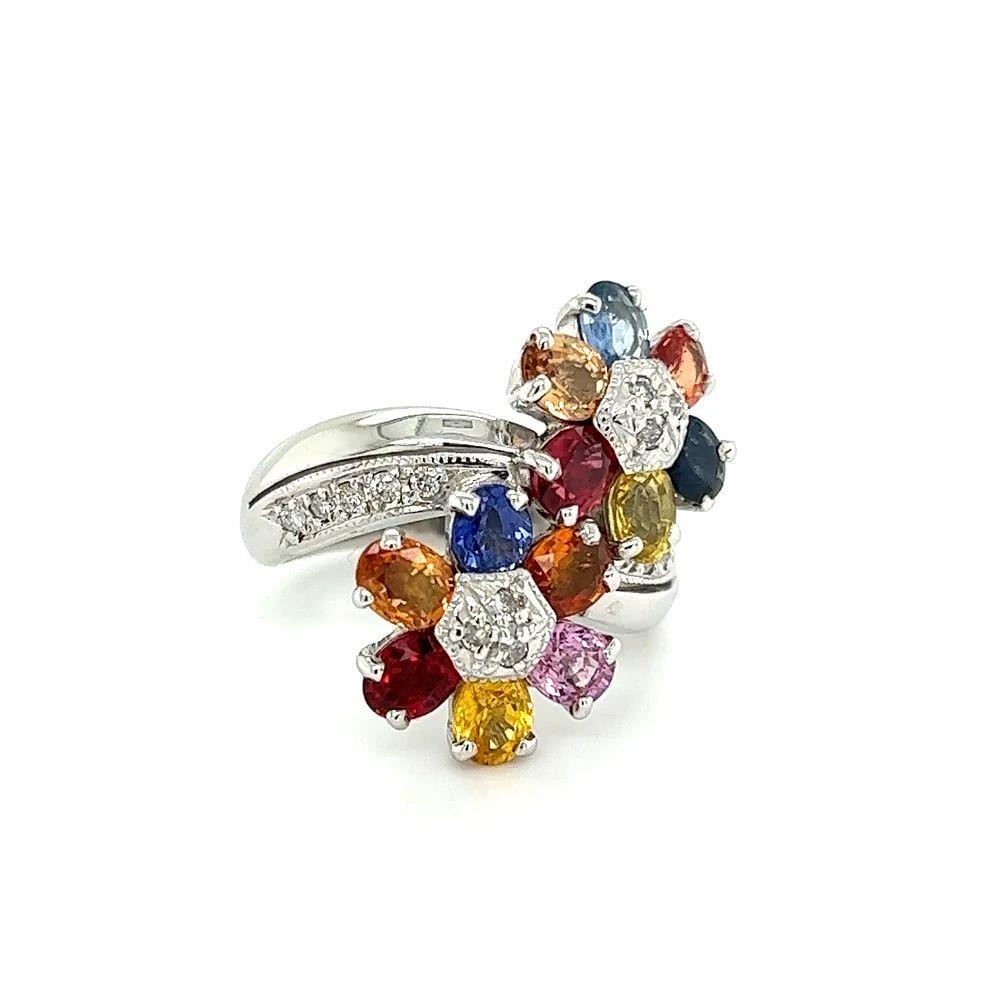 Simply Beautiful! Vintage 'Toi et Moi' Flower Crossover Floral Rainbow Sapphire and Diamond Bypass Diamond Gold Ring. Hand set with 4.05tcw Rainbow Sapphires and 0.18tcw Diamonds. Hand crafted 18K White Gold mounting. Ring size: 5.75, we offer ring