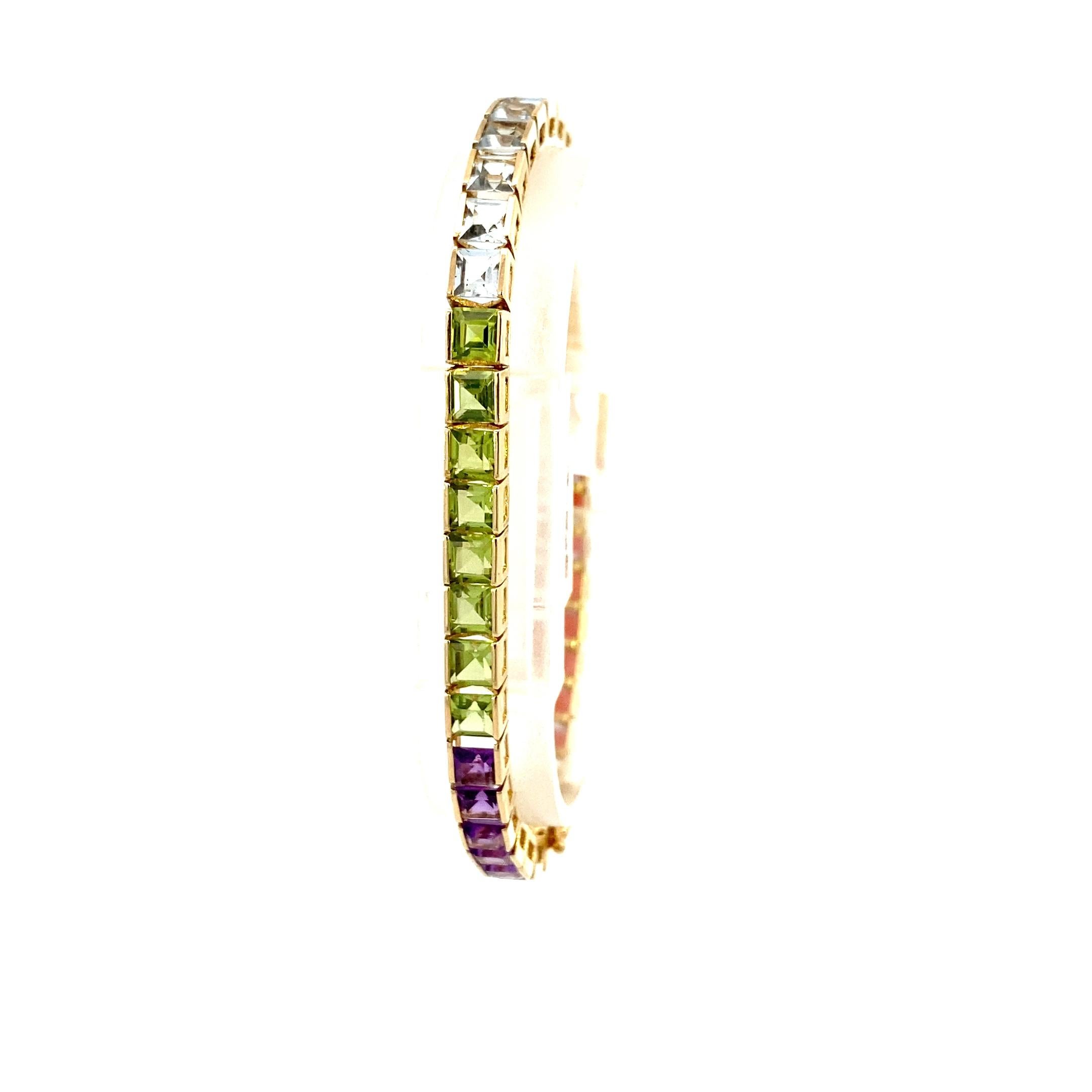 Vintage Rainbow Semi-Precious Stone Yellow Gold Bracelet. This stunning 7 inch long vintage rainbow of color bracelet has 41 square step cut stones in five different colors and stone types! From one end to the other there are 4.5 carat total weight