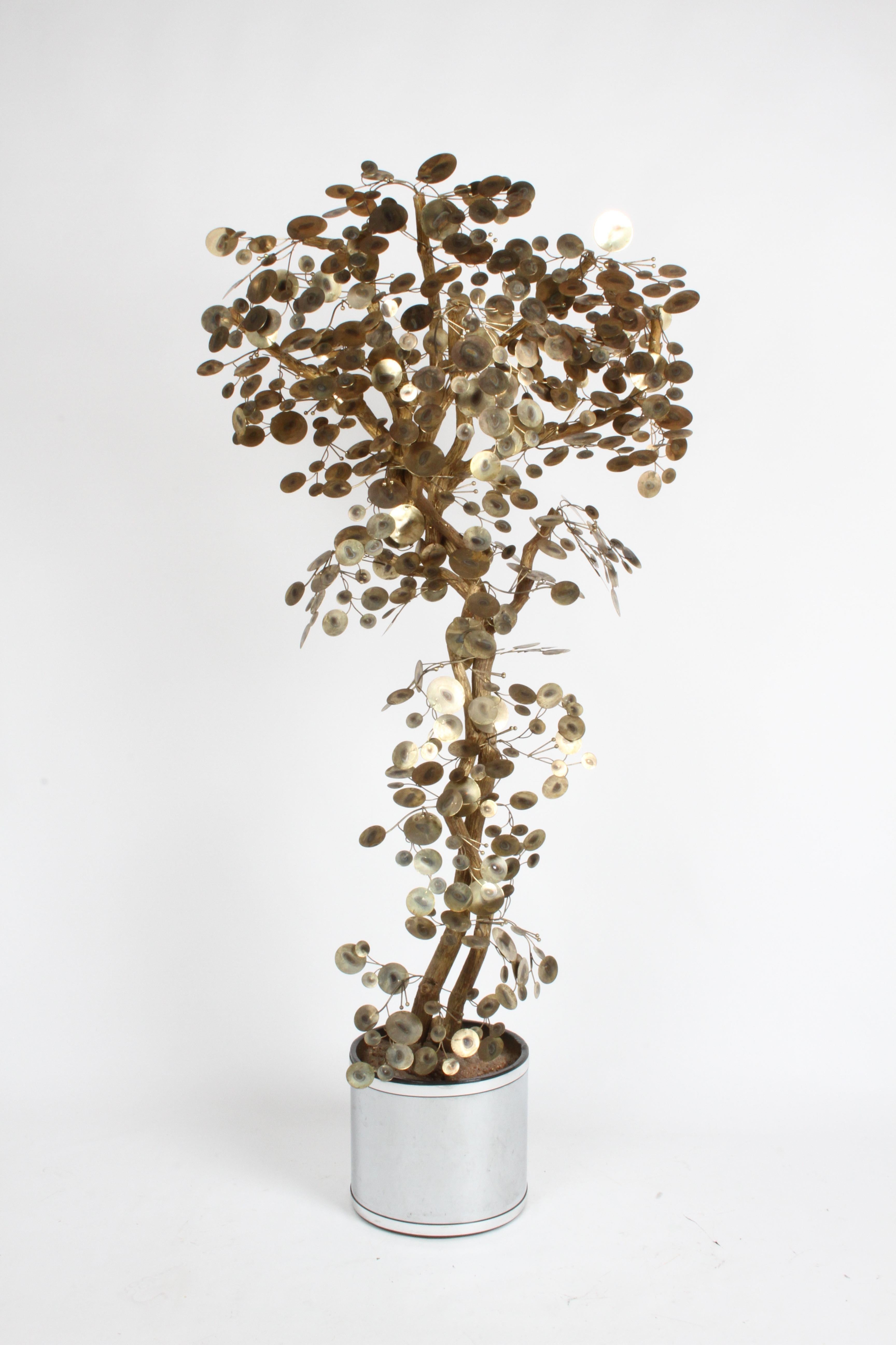 Vintage “Raindrops” tree sculpture by Curtis Jeré circa 1970s. This standing floor sculpture is constructed with natural tree branches, which have been painted gold, and decorated with elegant metal discs in a brass-plated finish that gives the form