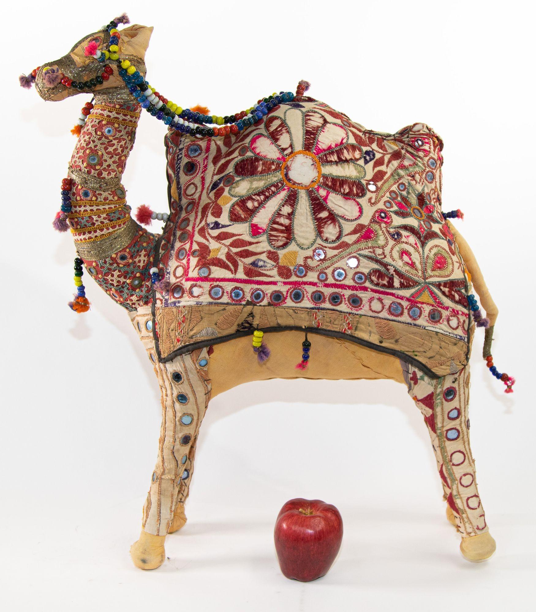 Vintage Raj embroidered large camel toy, India, 1950.
Handmade in Rajasthan, India, colorful fabric camel toy.
Vintage oversized camel stuffed cotton embroidered and decorated with small mirrors, great collector piece.
Anglo Raj, large stuffed