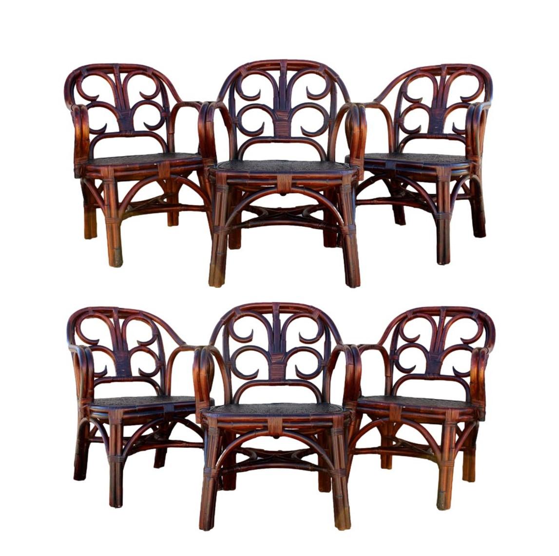 Elevate your dining experience with this amazing set of handmade bent rattan armchairs from Ralph Lauren. Beautiful and unique, the set of six vintage dining chairs retains the original rich mahogany finish. A dining table from the same collection