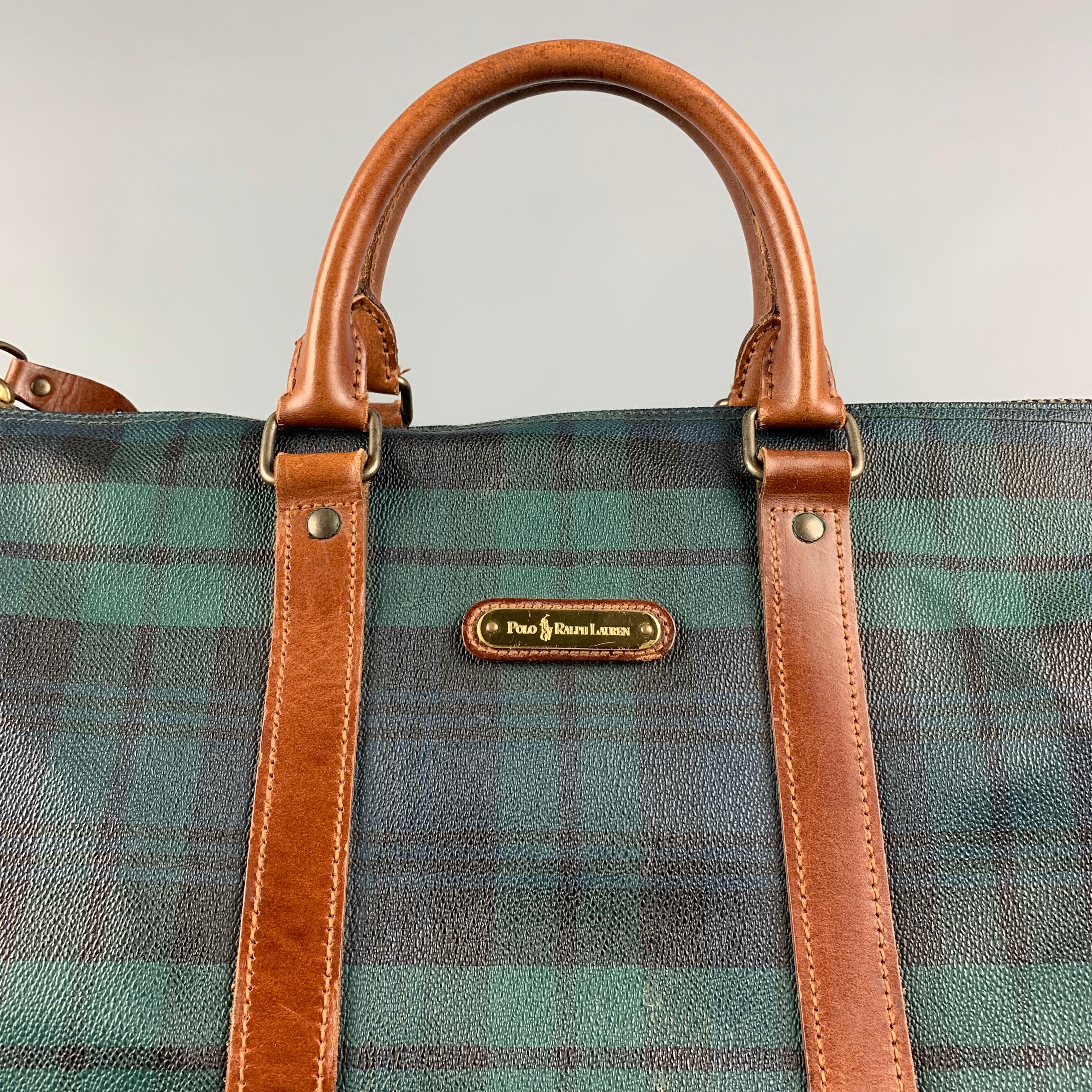 Vintage RALPH LAUREN bag comes in a green & black blackwatch coated canvas featuring a weekender style, top handles, inner compartment, top zipper closure. Missing strap. 

Good Pre-Owned Condition. Light marks throughout.

Measurements:

Length: 19