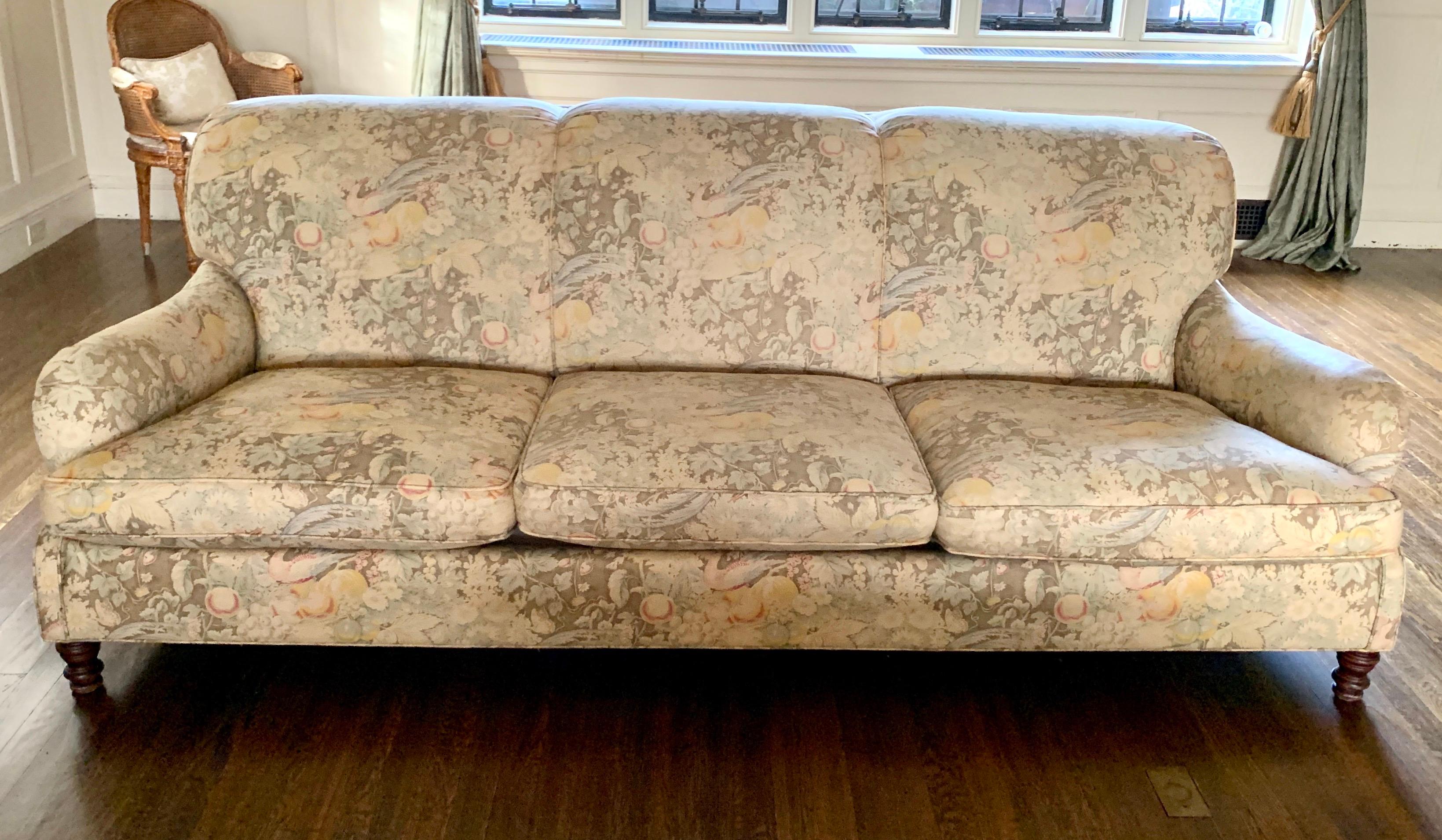 Elegant vintage signed Ralph Lauren three-seat sofa.
This vintage sofa, circa late 1970s, is all original and has down cushions. The fabric, also original, features a park like setting with birds, fruit and vegetation.