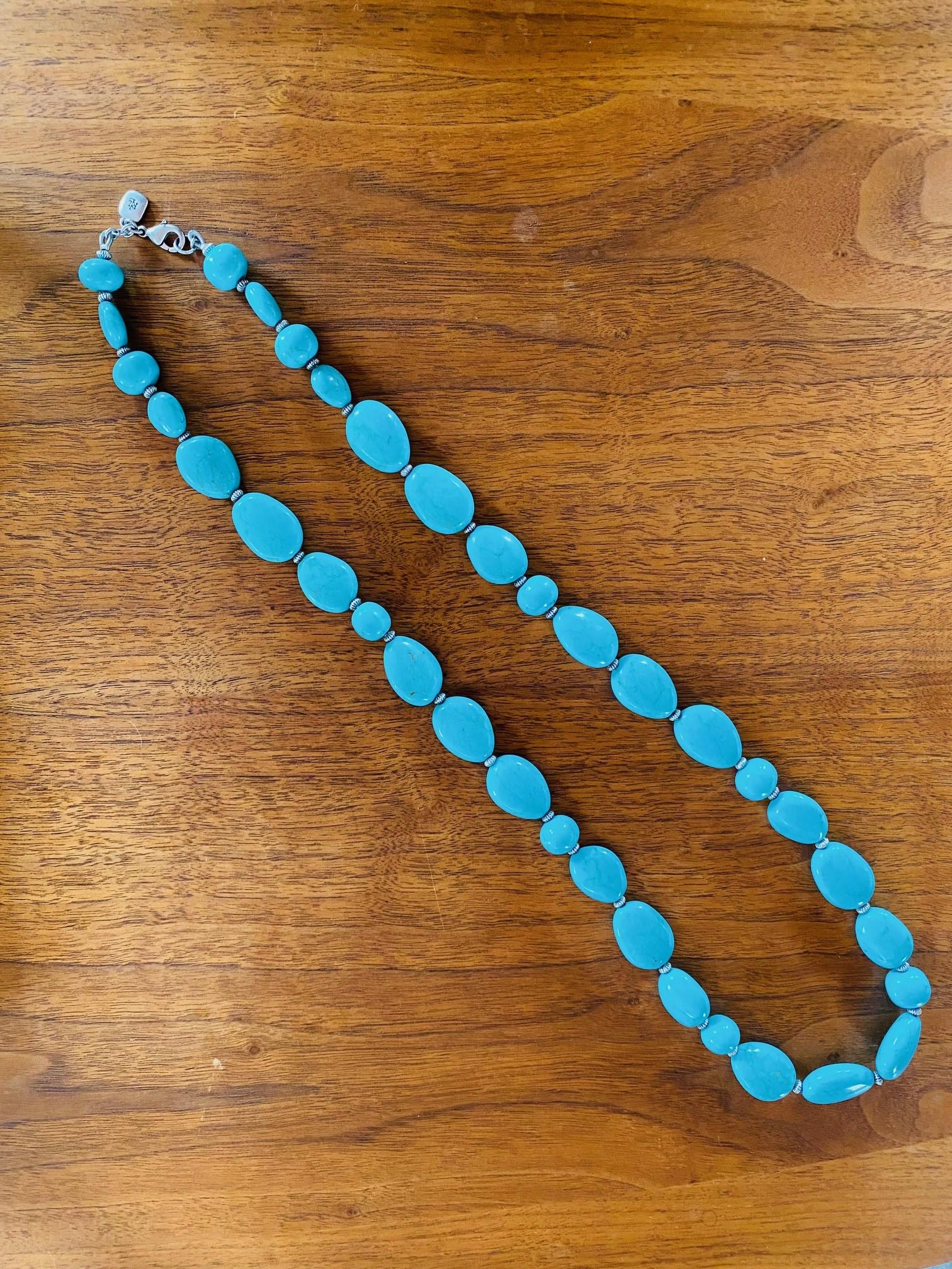 Beautiful vintage turquoise long necklace by Ralph Lauren.  This beautiful piece of jewelry is timeless, bohemian and chic.  This line of stone jewelry by Ralph Lauren is coveted as it is chic.  The beautiful shade of turquoise blue will complement