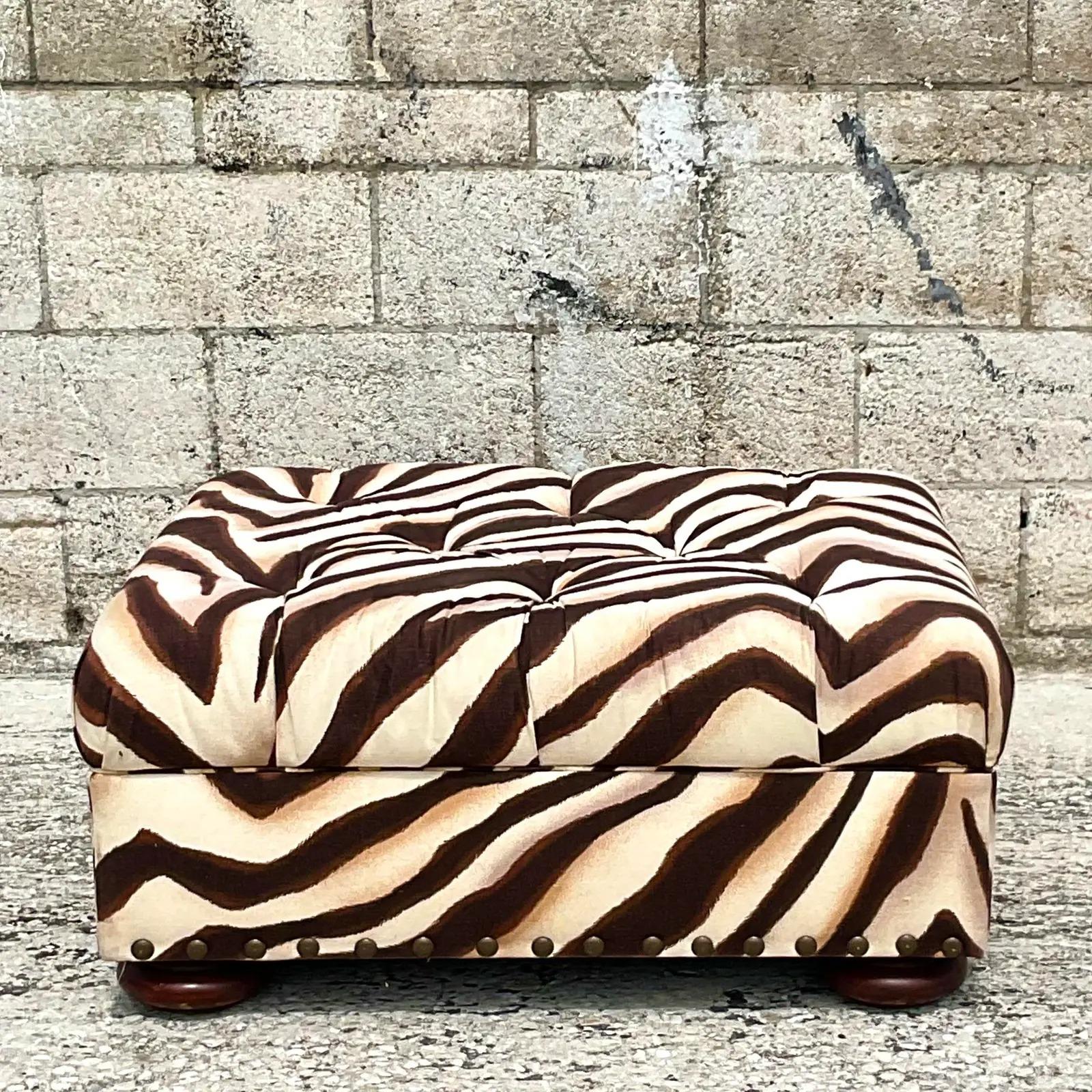 Fantastic vintage Zebra print ottoman. Beautiful tufted design with hand turned legs. Made by the iconic Ralph Lauren and tagged on the bottom. Acquired from a Palm Beach estate.