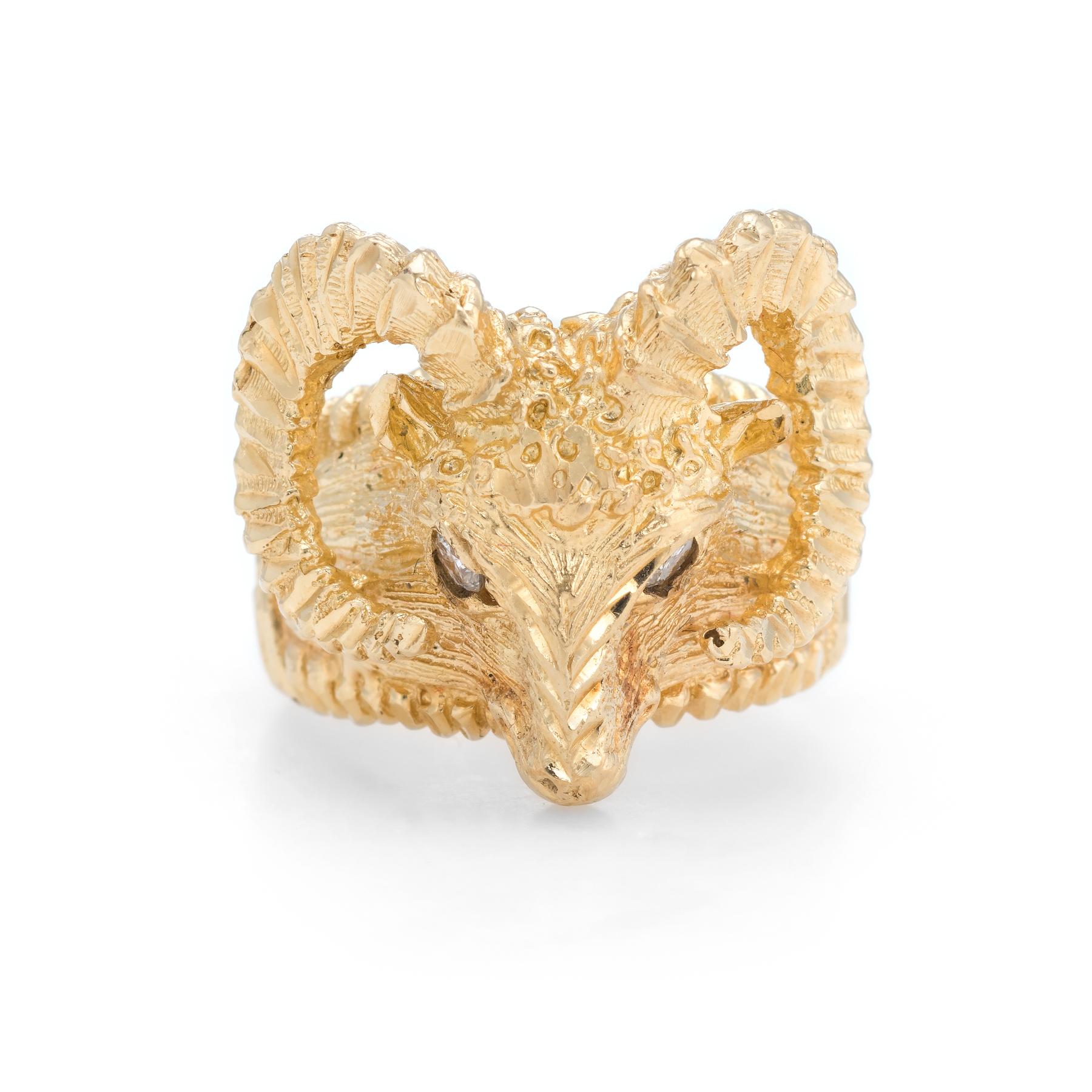 Finely detailed vintage cocktail ring, crafted in 14 karat yellow gold. 

Two estimated 0.05 carat round brilliant cut diamonds adorn the eyes. The total diamond weight is estimated at 0.10 carats (estimated at H-I color and I1 clarity). 

Bold and