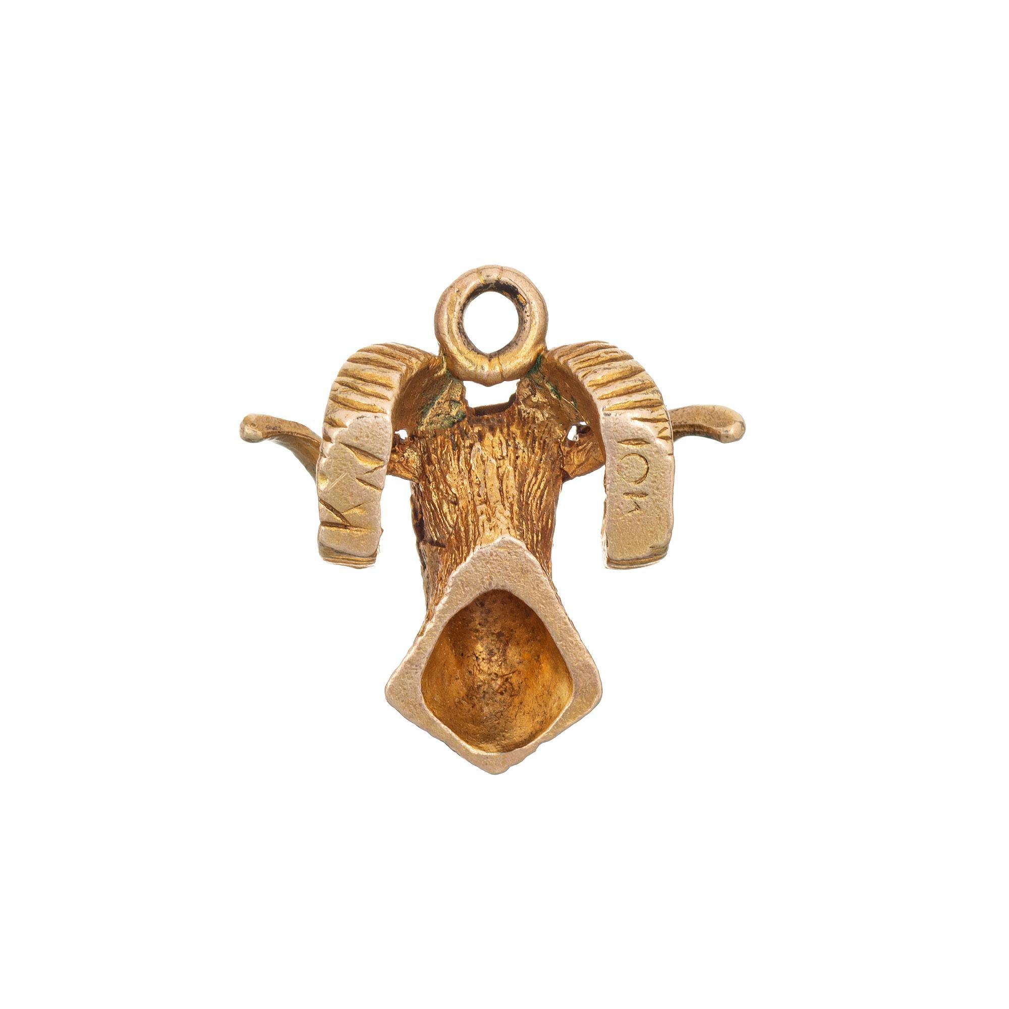 Finely detailed vintage Ram's Head charm crafted in 10k yellow gold.  

The Ram's head is rendered in lifelike detail with curled horns. The symbol for the zodiac sign of Aries, a sign of strength and boldness. The piece can be worn as a charm on a