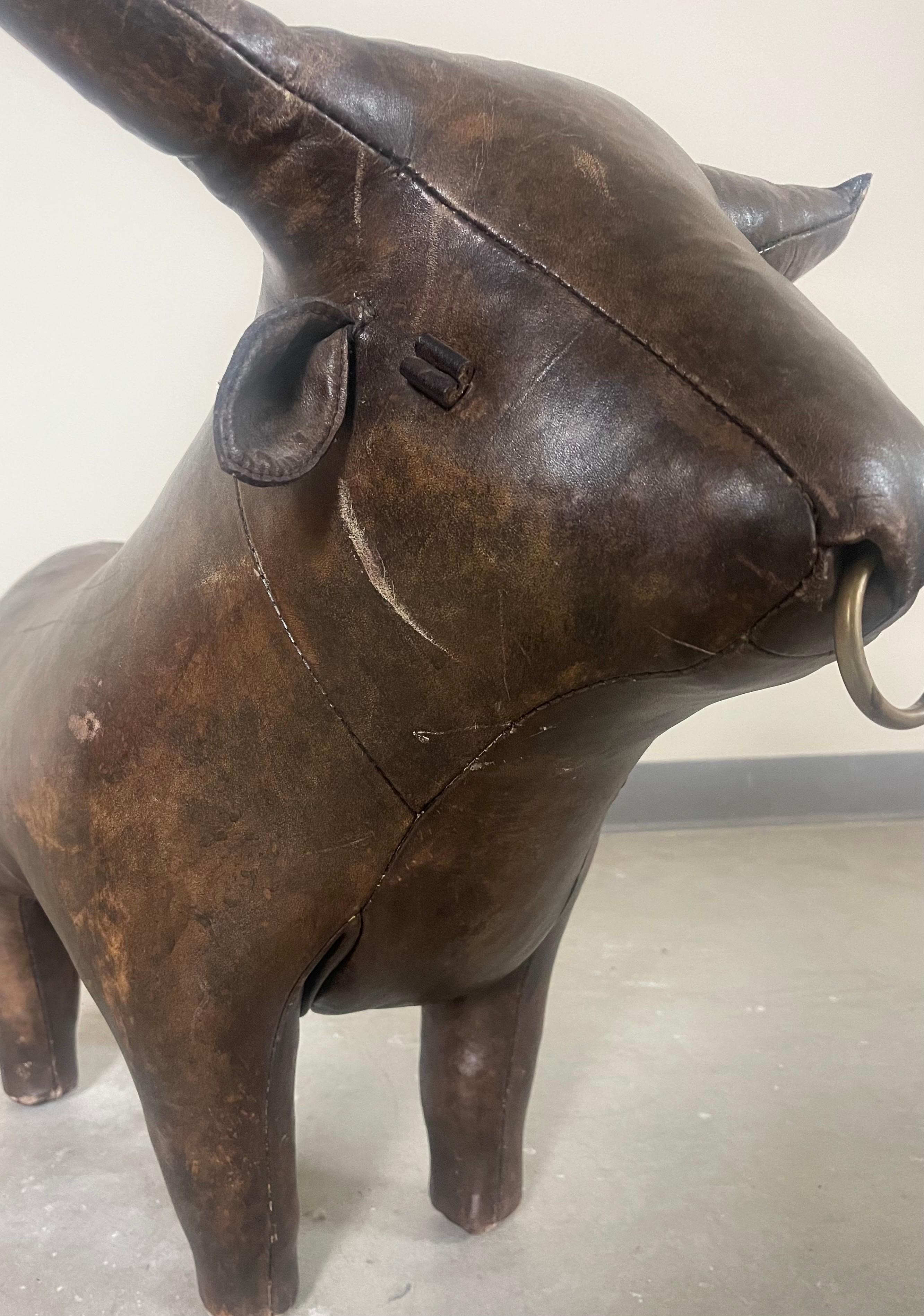 Vintage “Ranch Bull” in leather by Dimitri Omersa. First introduced in the 1960s by Abercrombie and Fitch. Maintains the original red tag by Omersa. Patina on leather and scuffing indicative of natural aging process.