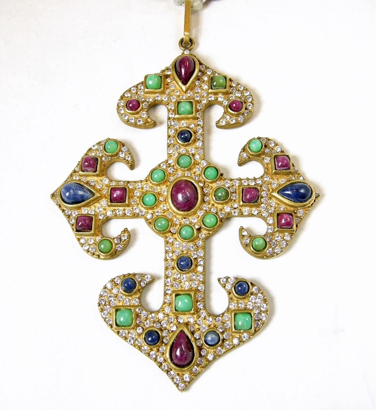 This is one of the rarest and most beautiful of all Valentino necklaces I have ever seen.  It has a strand of  green jade-like balls … each separated with tiny crystals.  They lead downward to alternating burgundy, blue and jade-like balls separated