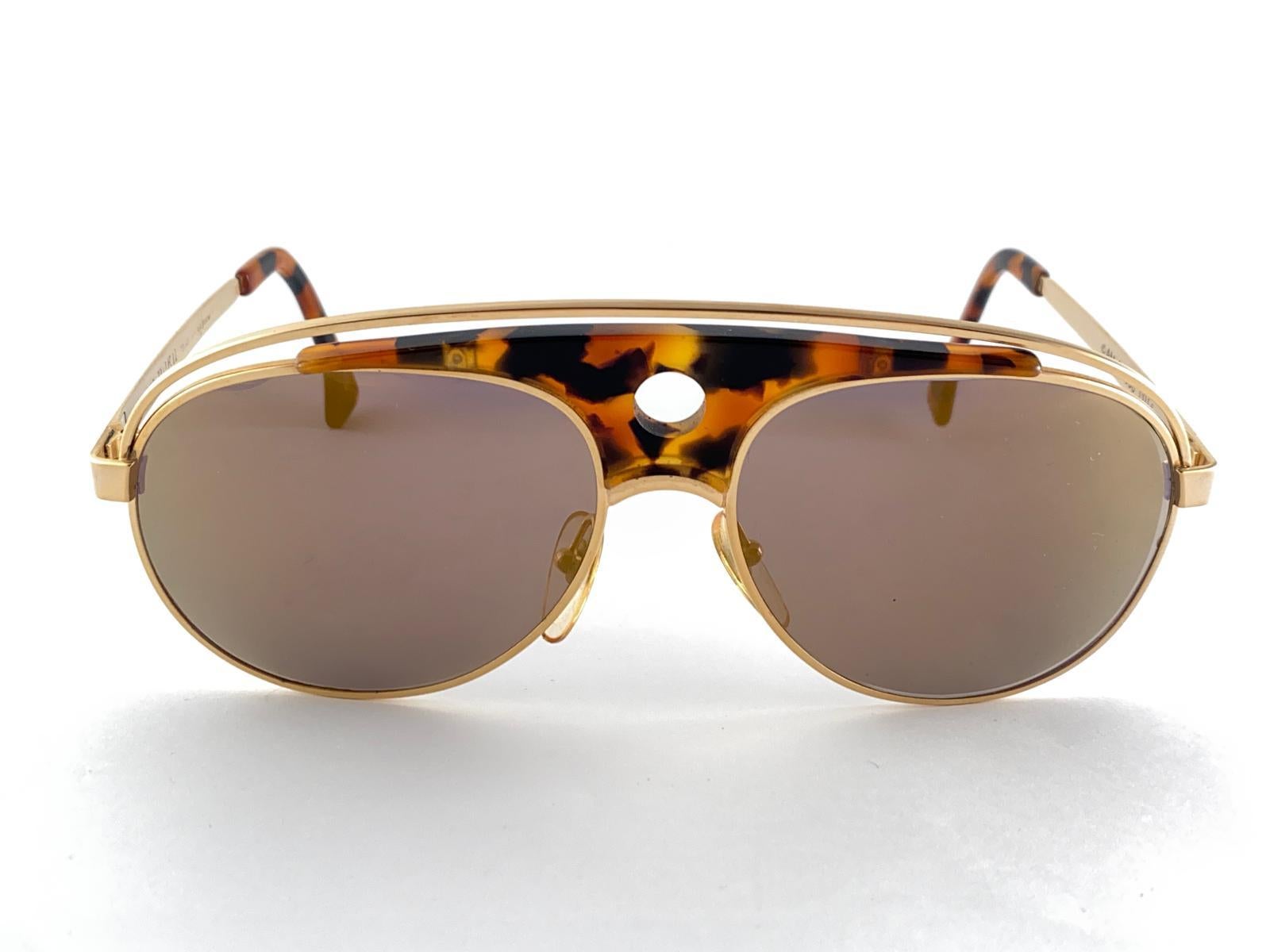 Vintage Rare Alain Mikli Aviator Frame. The original model not reissue, Also known as Lenny Kravitz's Mikli.

Spotless Gold Mirror Lenses.  

Please Consider That This Item Is Nearly 40 Years Old So It  Show Minor Sign Of Wear Due To Storage.  
Made