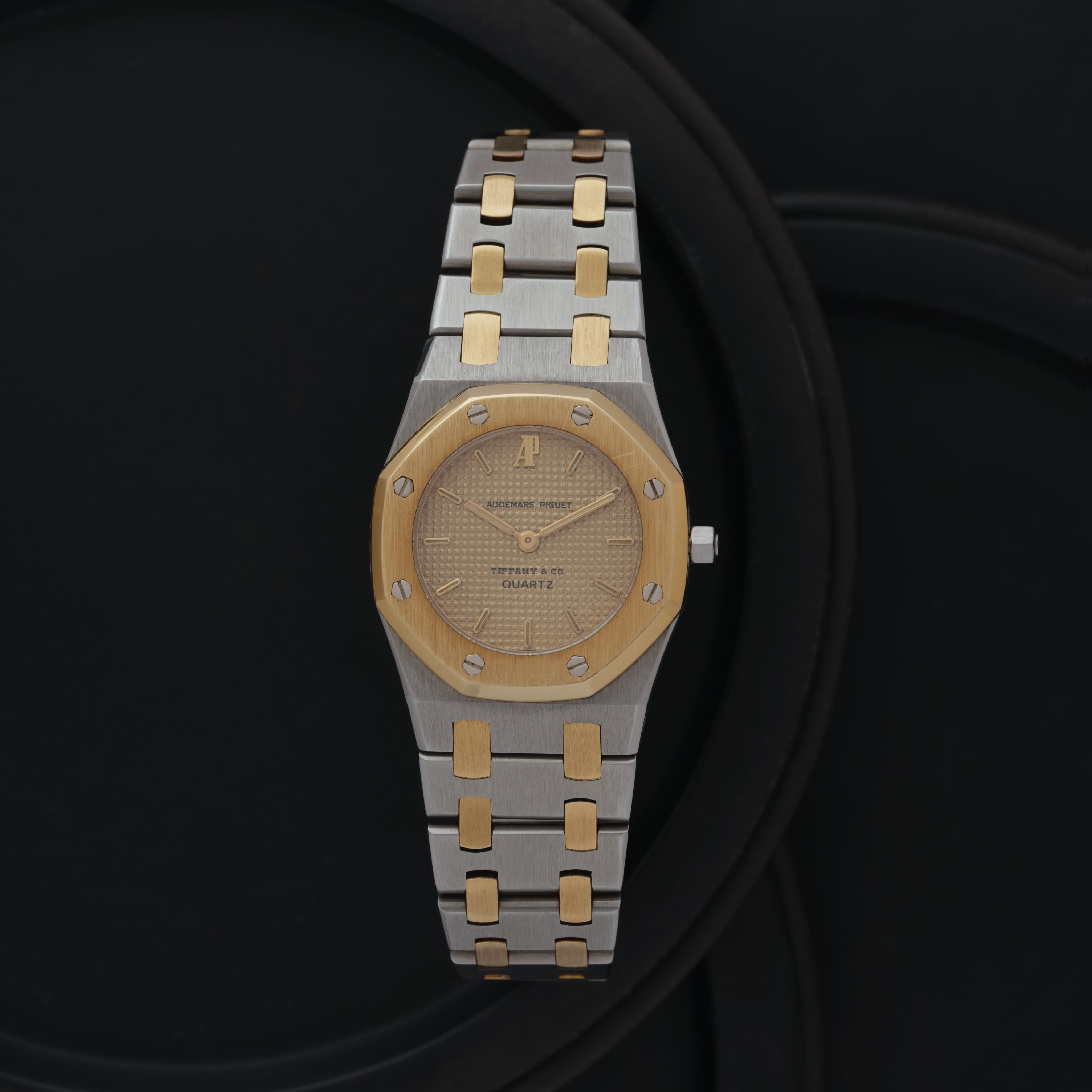 Maker: Audemars Piguet x Tiffany & Co.
Model: Royal Oak 6007SA
Year: 1988
Material: 18 Karat Yellow Gold and Stainless Steel
Dial: Gold Tapisserie with Audemars Piguet x Tiffany & Co. (Rare)
Case Measurement: 25mm
Movement: Quartz
Condition: Very