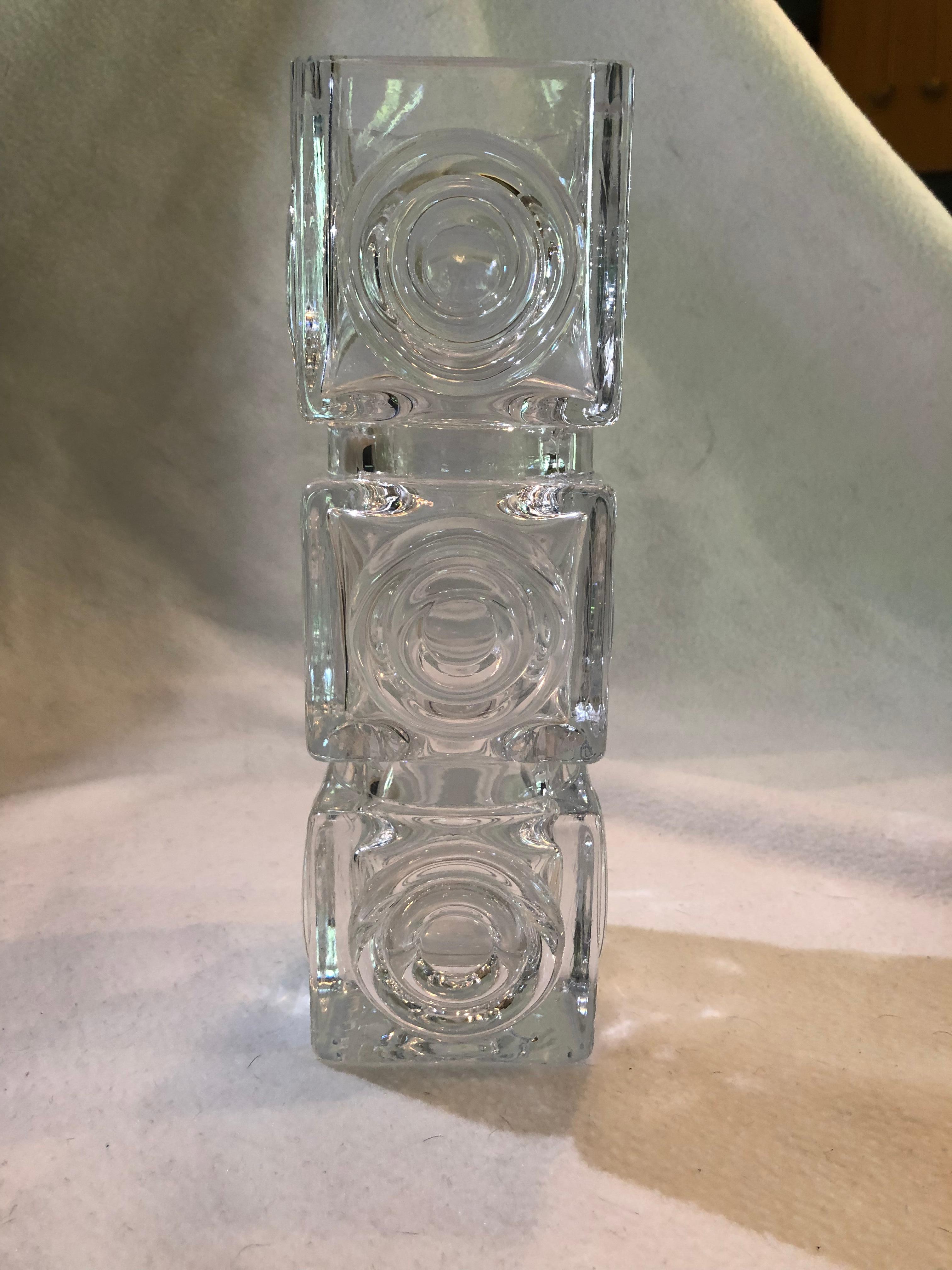 A fine and rare stylish vintage Swedish art glass vase designed by Bengt Edenfalk for Skruf Glasbruk. The tall square shaped crystal glass vase has a circle medallions design around the four side. The base is engraved 'Edenfalk Skruf.