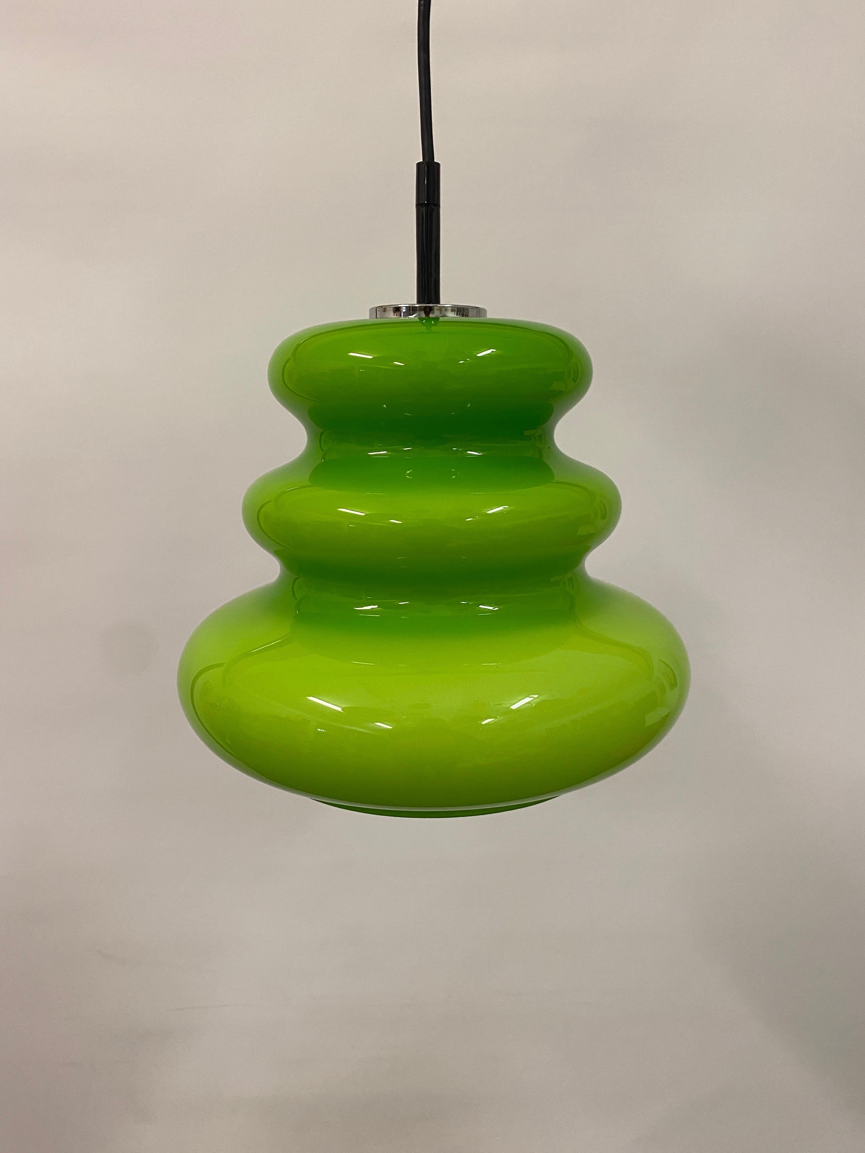 What - a - find! This rare green pendant light is made by the German company Peill and Putzler around 1960. This color is extremely rare but I was lucky enough to get one. 

Lights up amazing and produces a very soft light. 

Dimensions
Height: