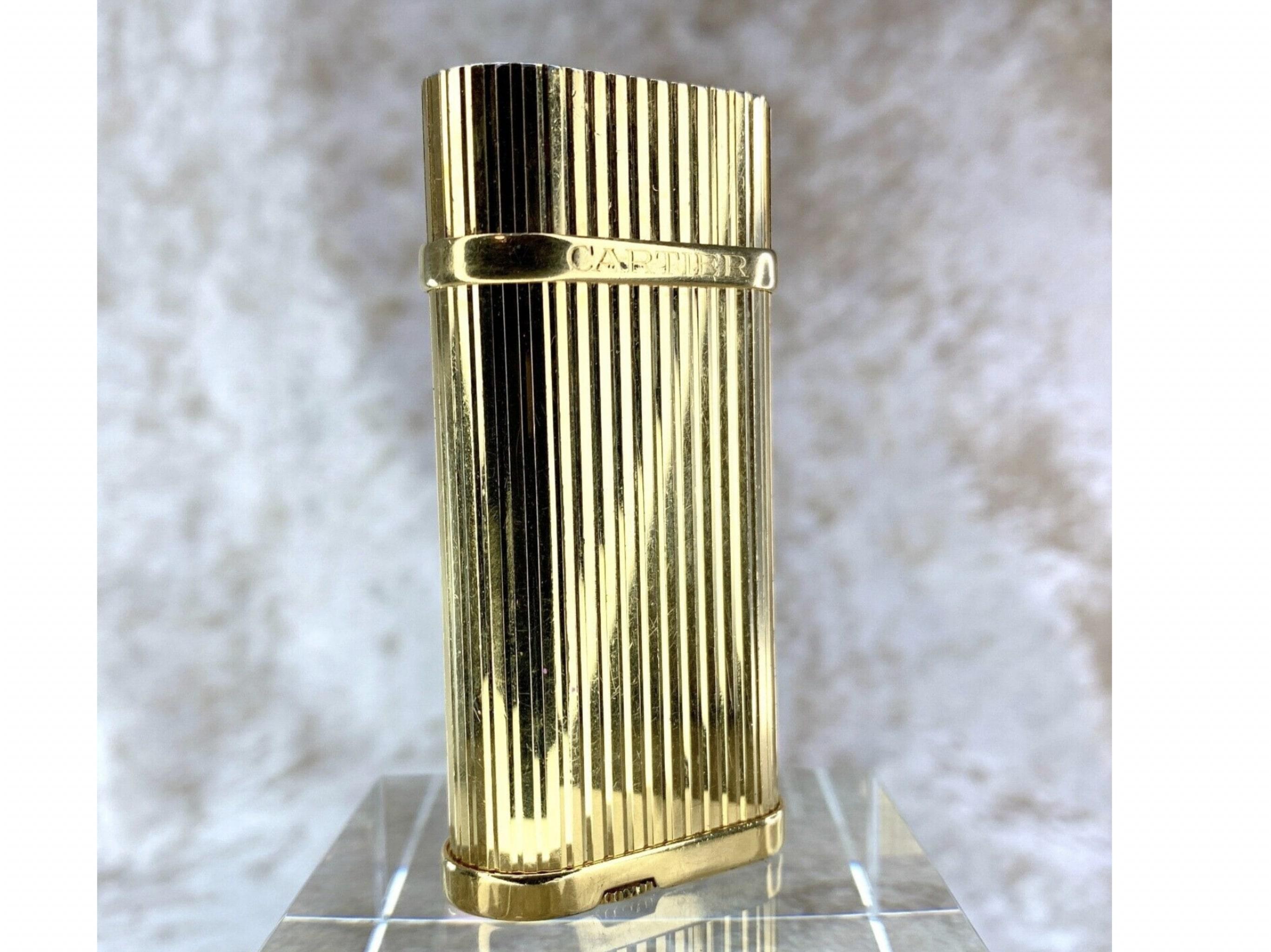 Cartier Lighter in 18k Gold Plate Godron Model
Circa 2000
Retro 
Vintage 
Rare 
Gold color 
Cartier sparks, ignites and flames 