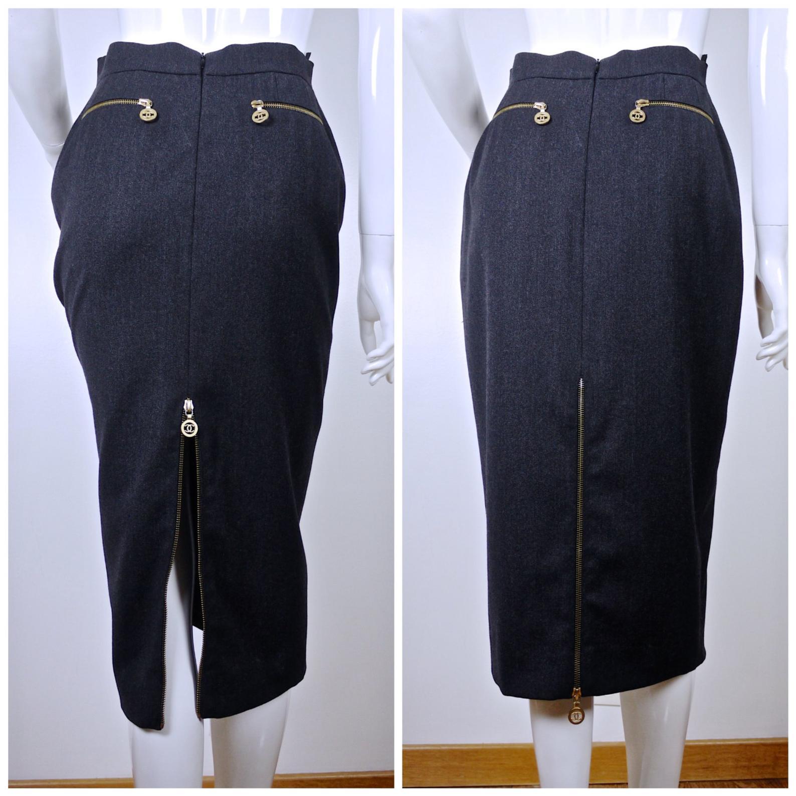 Vintage RARE CHANEL CC Medallion Zippered Pencil Skirt

Measurements taken laid flat, please double waist and hips:
Waist: 13 inches
Hips: 18.5 inches
Length: 29.5 inches

Features:
- 100% Authentic CHANEL.
- Dark gray pencil cut skirt.
- Horizontal