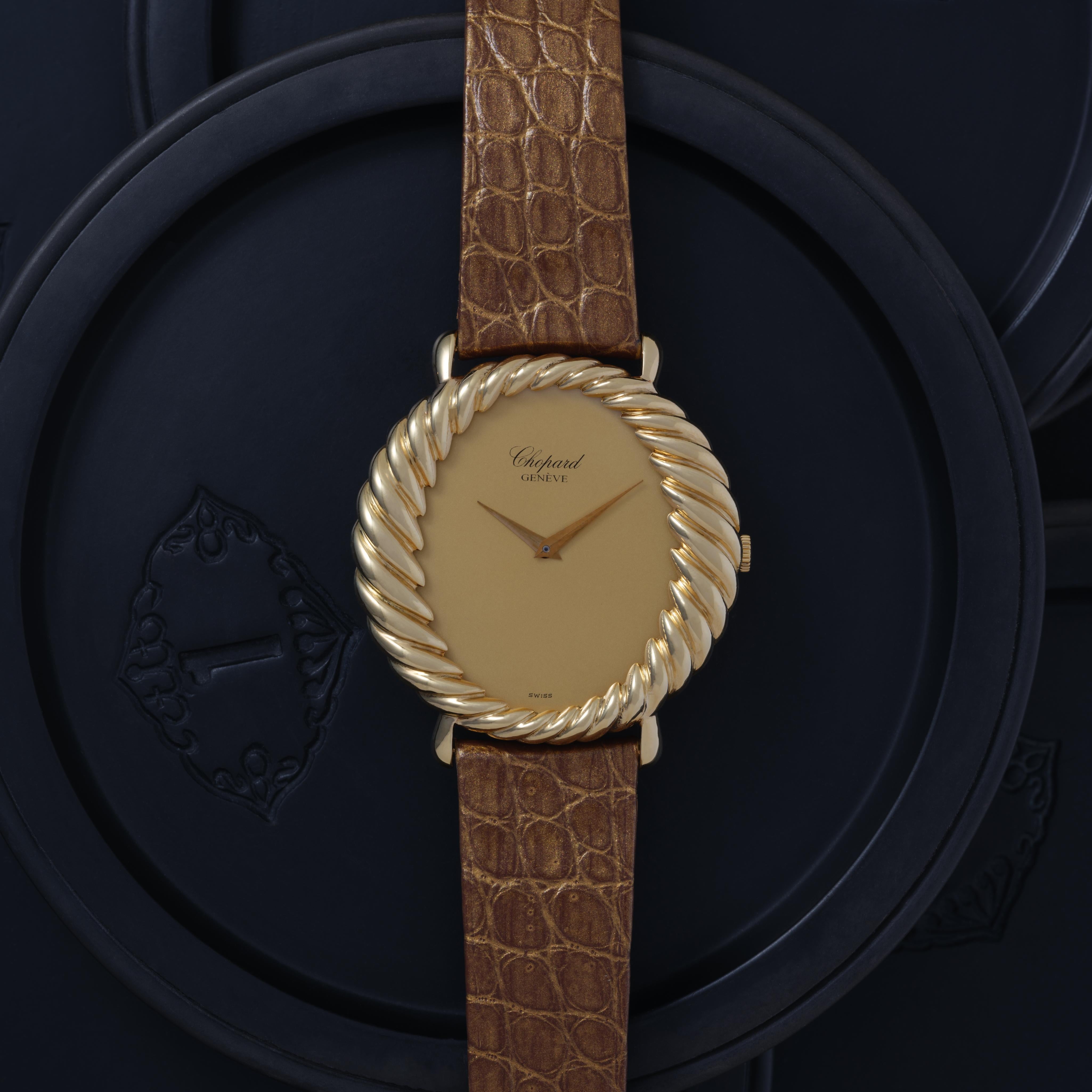 Vintage Rare Chopard 18k Yellow Gold, Model 4015/1, Manual Wind, Made in Switzerland c.1977 with Chopard Service Card 2025 and Chopard travel pouch

Maker: Chopard
Model: 4015
Year: 1977
Material: 18k Yellow Gold on Bespoke Jean Rousseau Strap
Dial: