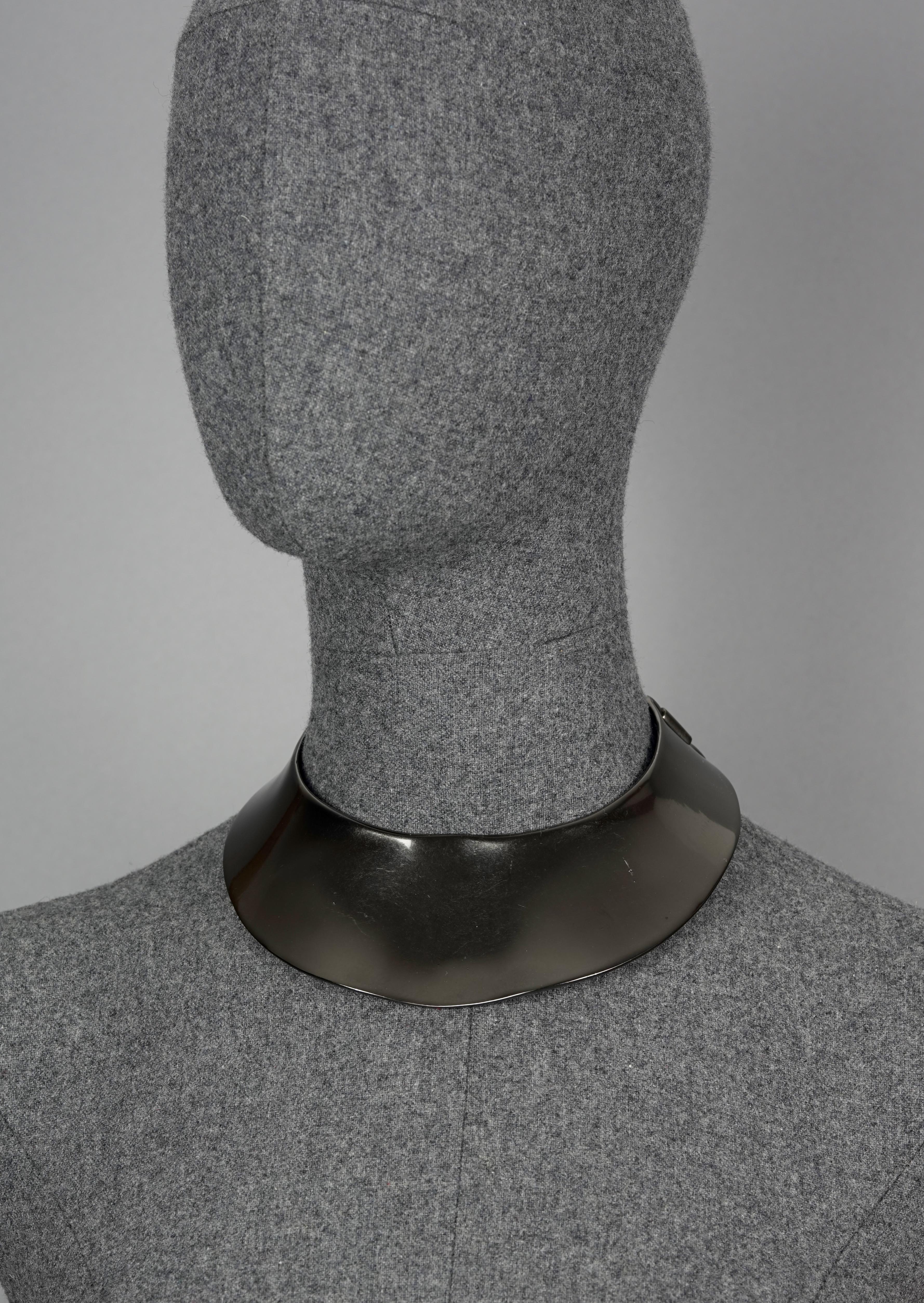 Vintage RARE CHRISTIAN DIOR by Robert Goossens Space Age Bib Collar Choker Necklace

Measurements:
Height: 2 1/8 inches (center)

Features:
- 100% Authentic CHRISTIAN DIOR.
- Space age style bib collar choker.
- Irregular shape.
- Metallic gray