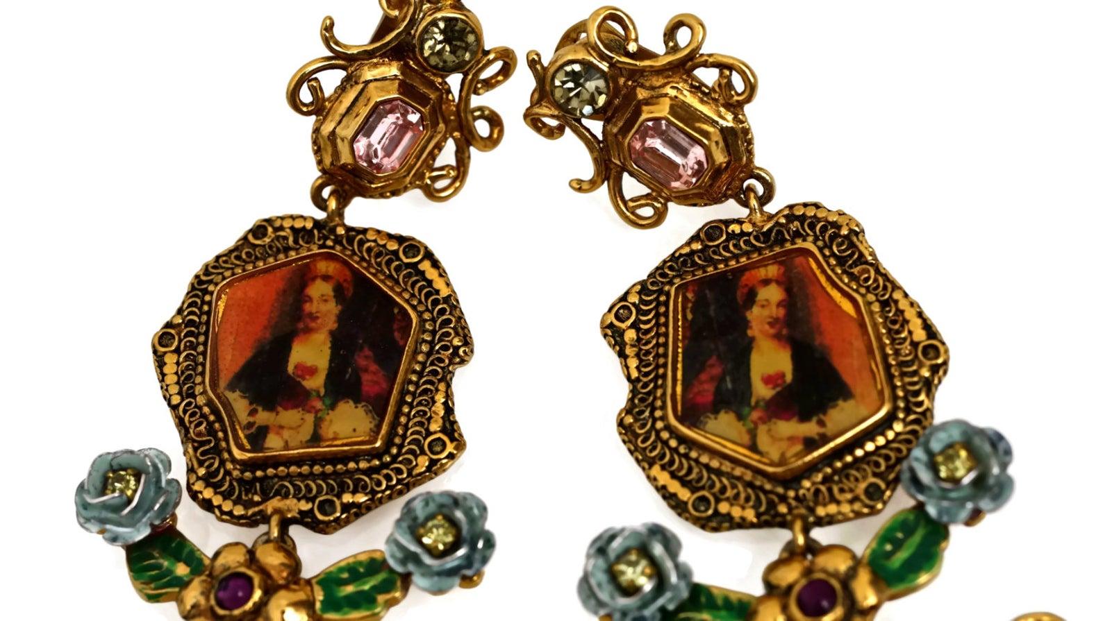 Vintage RARE CHRISTIAN LACROIX Baroque Portrait Cameo Earrings

Measurements:
Height: 4 3/8 inches
Width: 1 5/8 inches

Features:
- 100% Authentic CHRISTIAN LACROIX.
- Lady portrait on a frame.
- Embellished with faceted rhinestones, enamel flowers