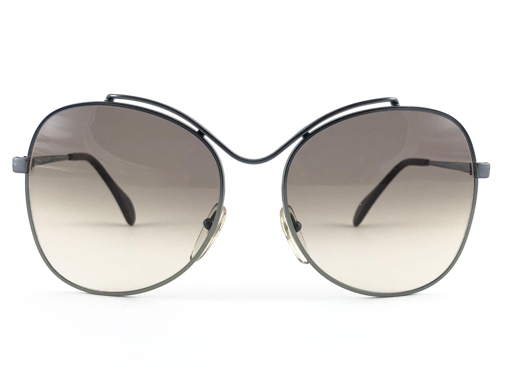 Sunglasses circa 1970's by Menrad.  

Please noticed this item its nearly 50 years old and has been on a private collection, therefore the frame show sign of wear according to age and minimum wear. 
Made in France.

MEASUREMENTS:


