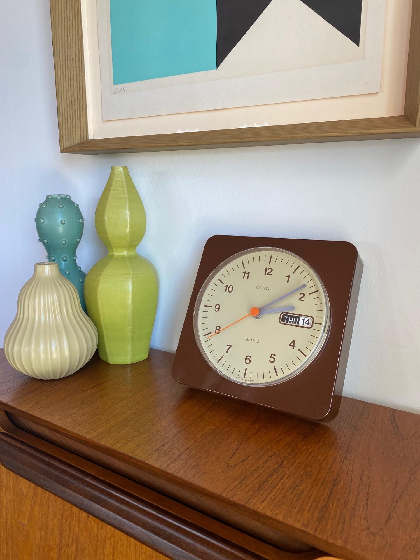 Incredible time piece. Great design on this wall clock by Kienzle, made in Germany circa late 1970's all plastic with calendar.  The piece is streamlined and highlights it’s specific polished style. This timepiece evokes a style that is timeless and