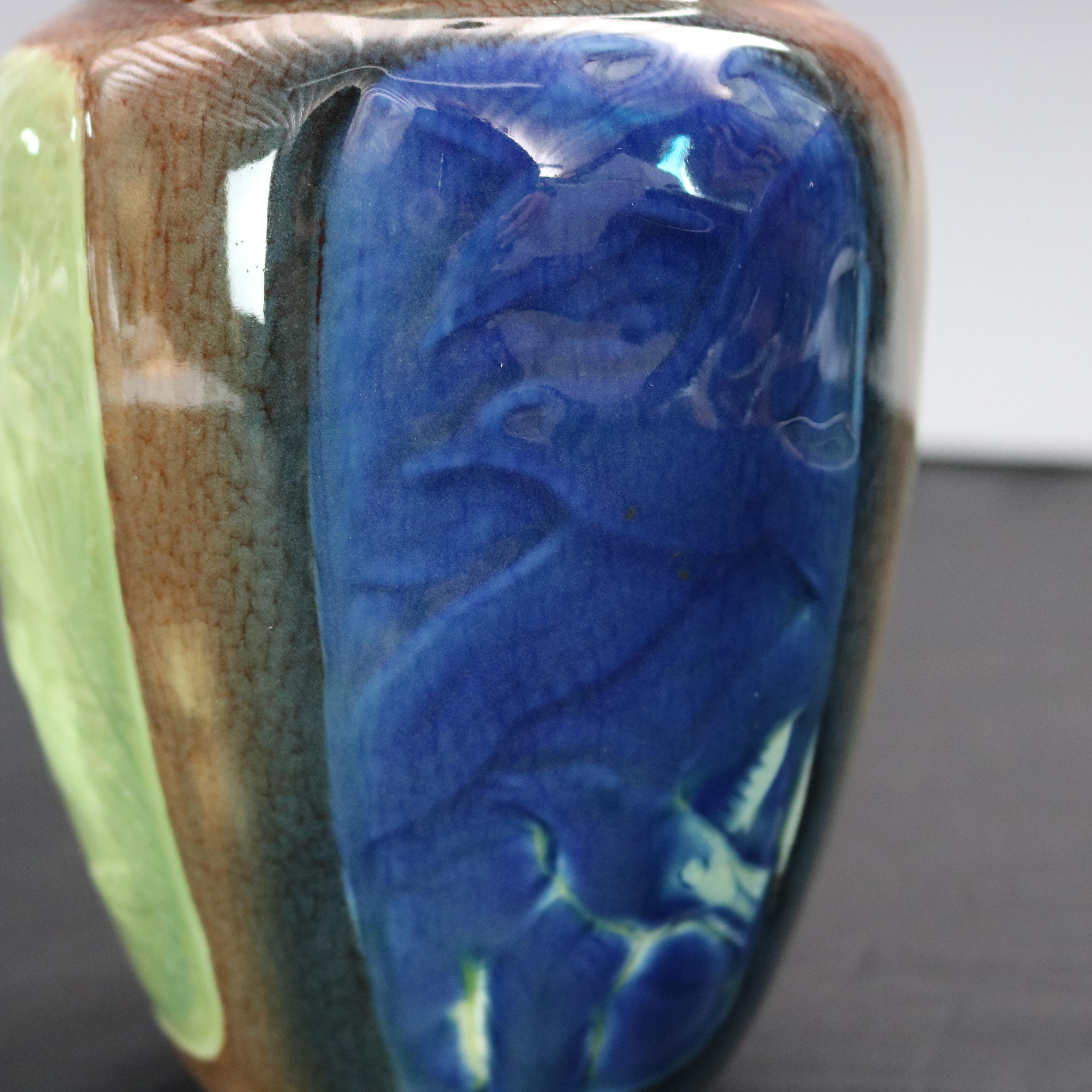 A rare vintage art pottery vase by Rookwood offers paneled form with reserves of birds, frog and fish in iris glaze, signed and dated as photographed, 1939

Measures: 8.25