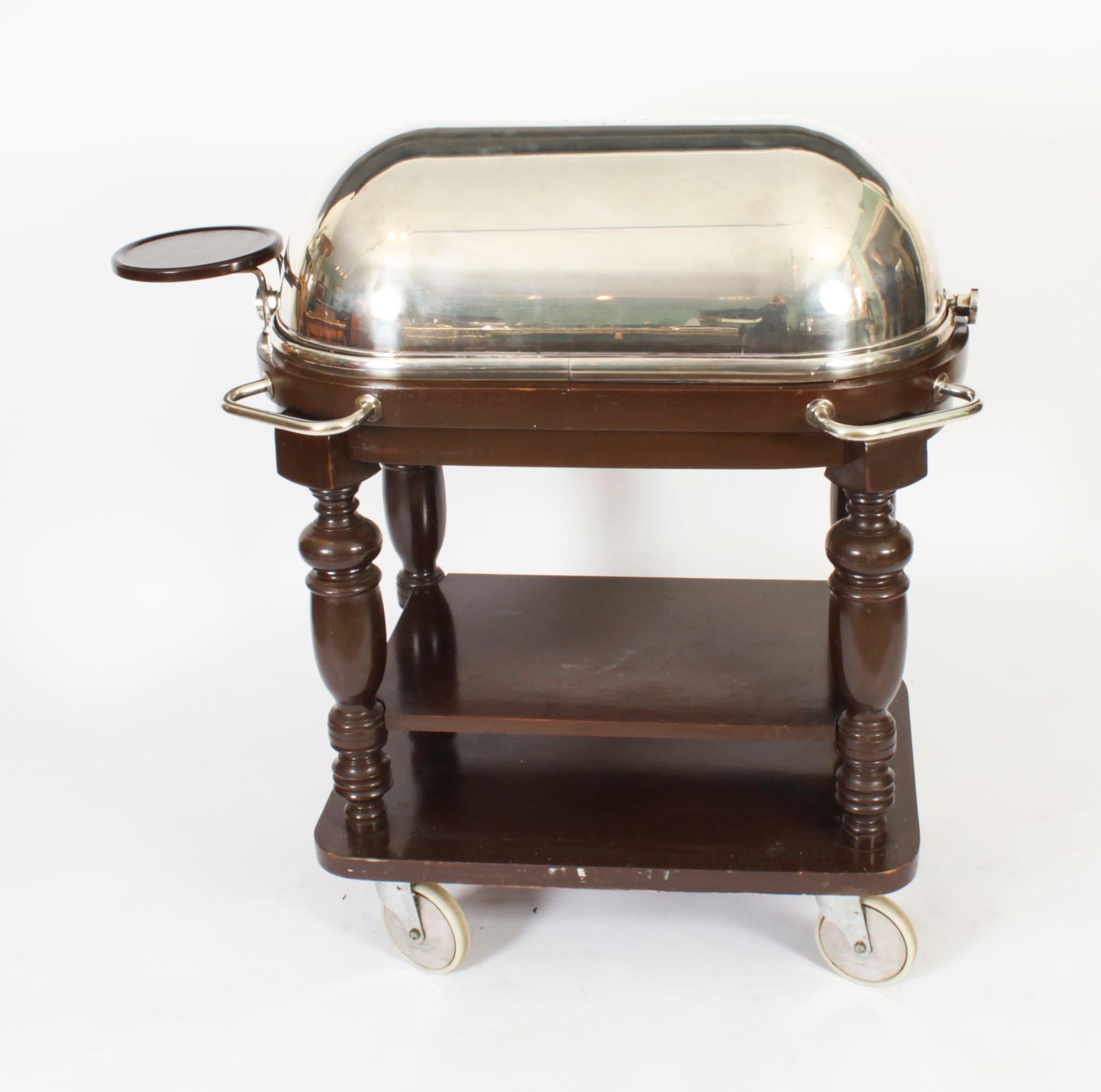 This is a magnificent and rare, Kaymet silver plated serving trolley with revolving dome, dating from the mid 20th Century.
 
​It is one of the most desirable models that they made, with the revolving dome which makes it very easy to use.

This