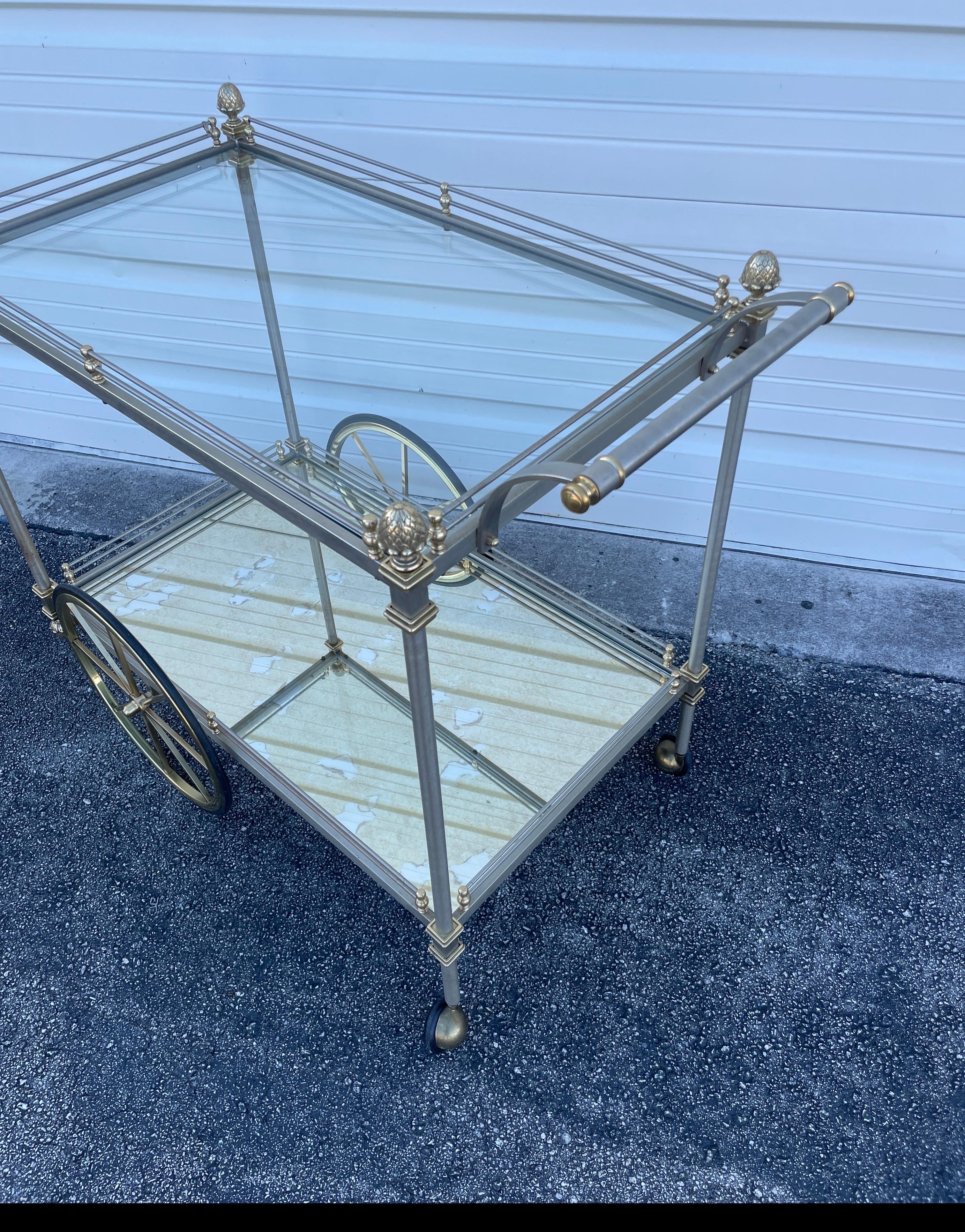 Vintage rare Maison Jansen brushed steel and brass bar cart with acorn finials on all four corners.