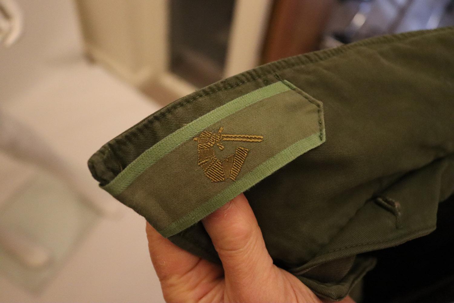 A chic , useful and historic C52 jacket from the second world war. This jacket was supplied to the Swedish army. In Khaki coloured cotton , the jacket has the original C52 label and gold emblem on the collar. it has a drawstring waist, button front