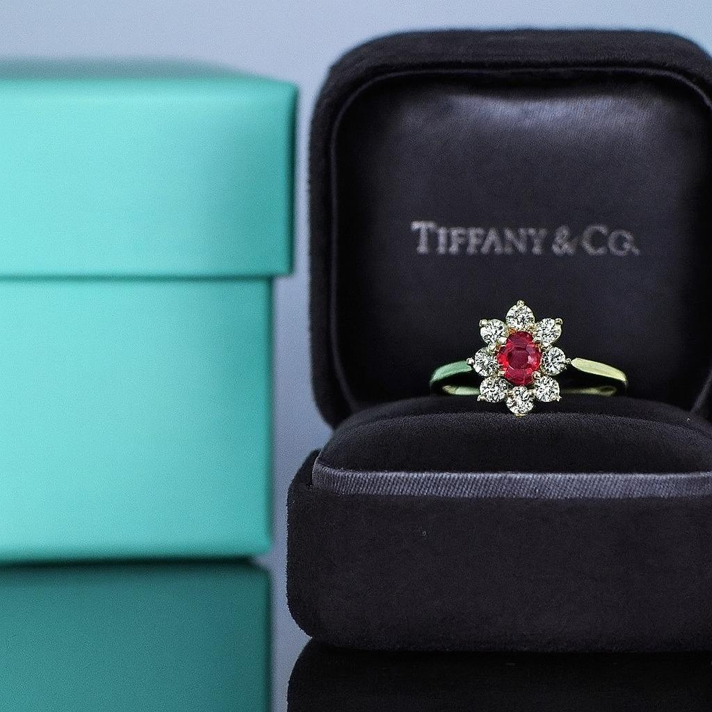 Vintage Rare Tiffany 18K Yellow Gold Ruby Diamond Ring

A truly rare vintage piece by Tiffany & Co., crafted in rich 18K yellow gold and set with a magnificent GIA-certified Burmese ruby. The ruby is an oval cut, weighing 1.00 carat, completely