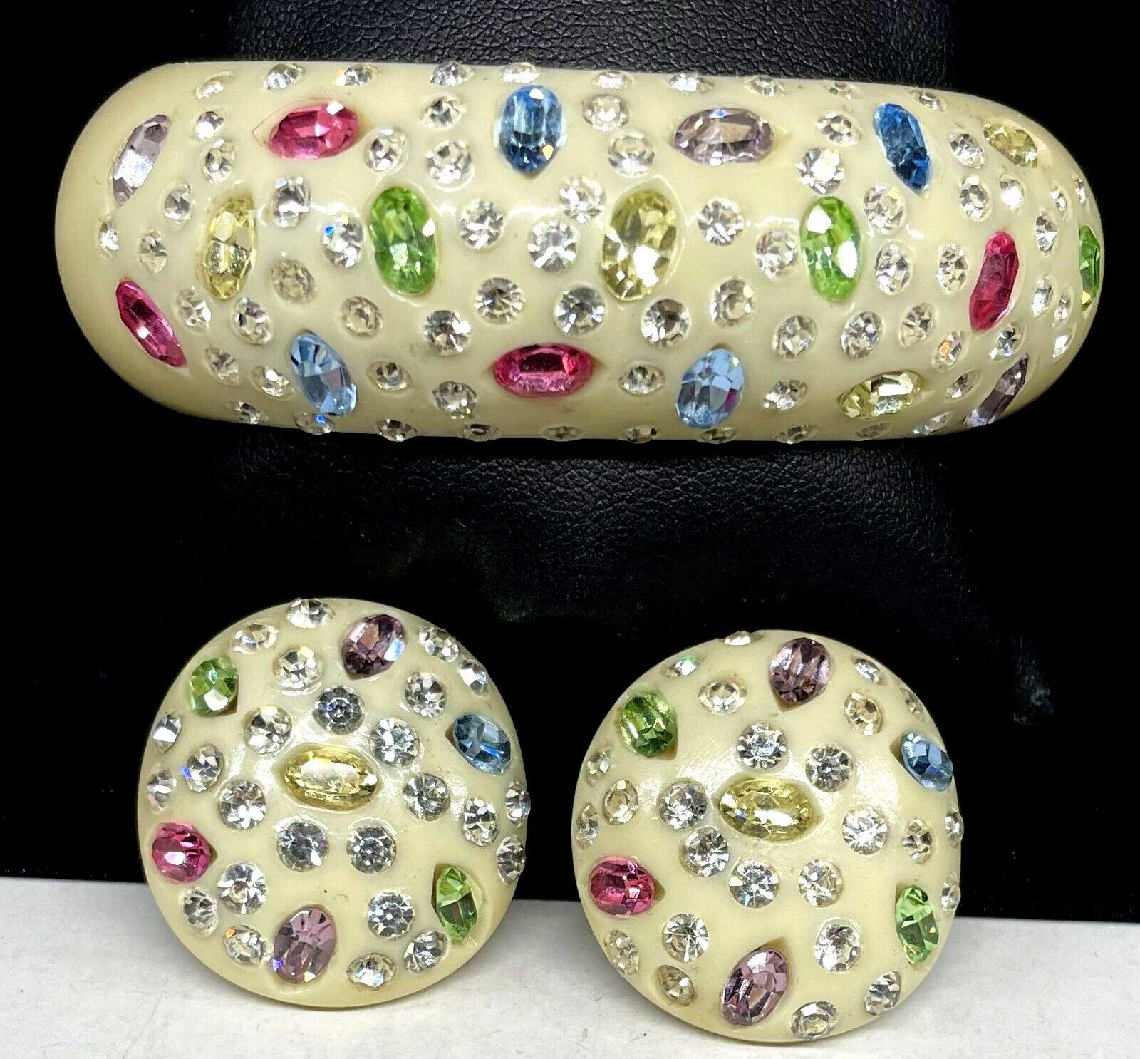 Simply Beautiful! Rare Vintage Mid Century Modern Signed Designer Weiss Clamper Lucite and Crystal Bracelet and matching Clip-on Earrings. Encrusted with Sparkling Multi faceted and colored Crystals. Earrings measure approx. 1.25” Rare and