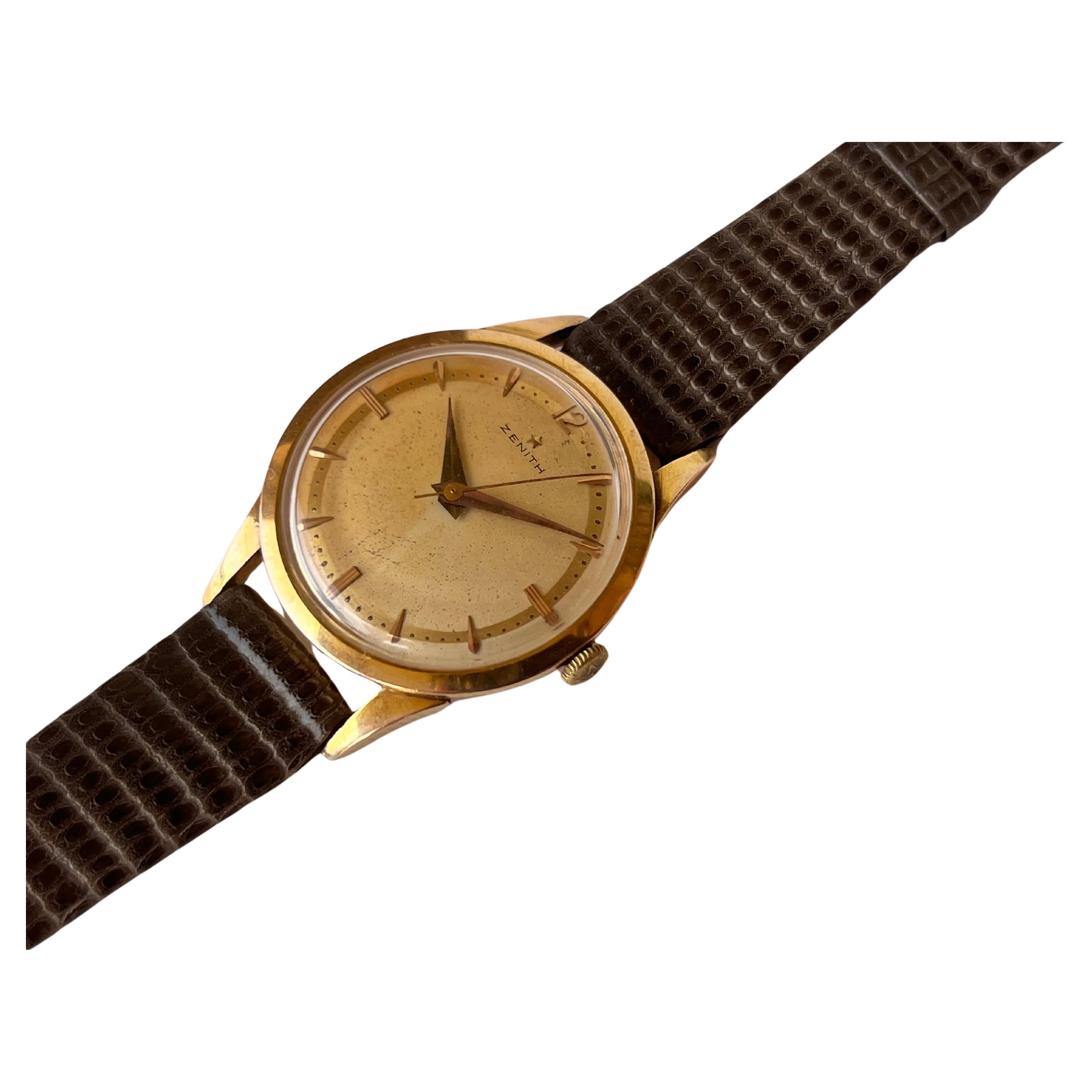 Brand : Zenith Star

Model: Zenith Star Mechnical Bumper Cal 120 cas Men's Watch 36mm

Reference Number : 9219136

Features : 18Jewels - Gold Filled 80 Mic

Country Of Manufacture: Switzerland

Movement: Hand Wind

Case Material: 80 Mic Hand