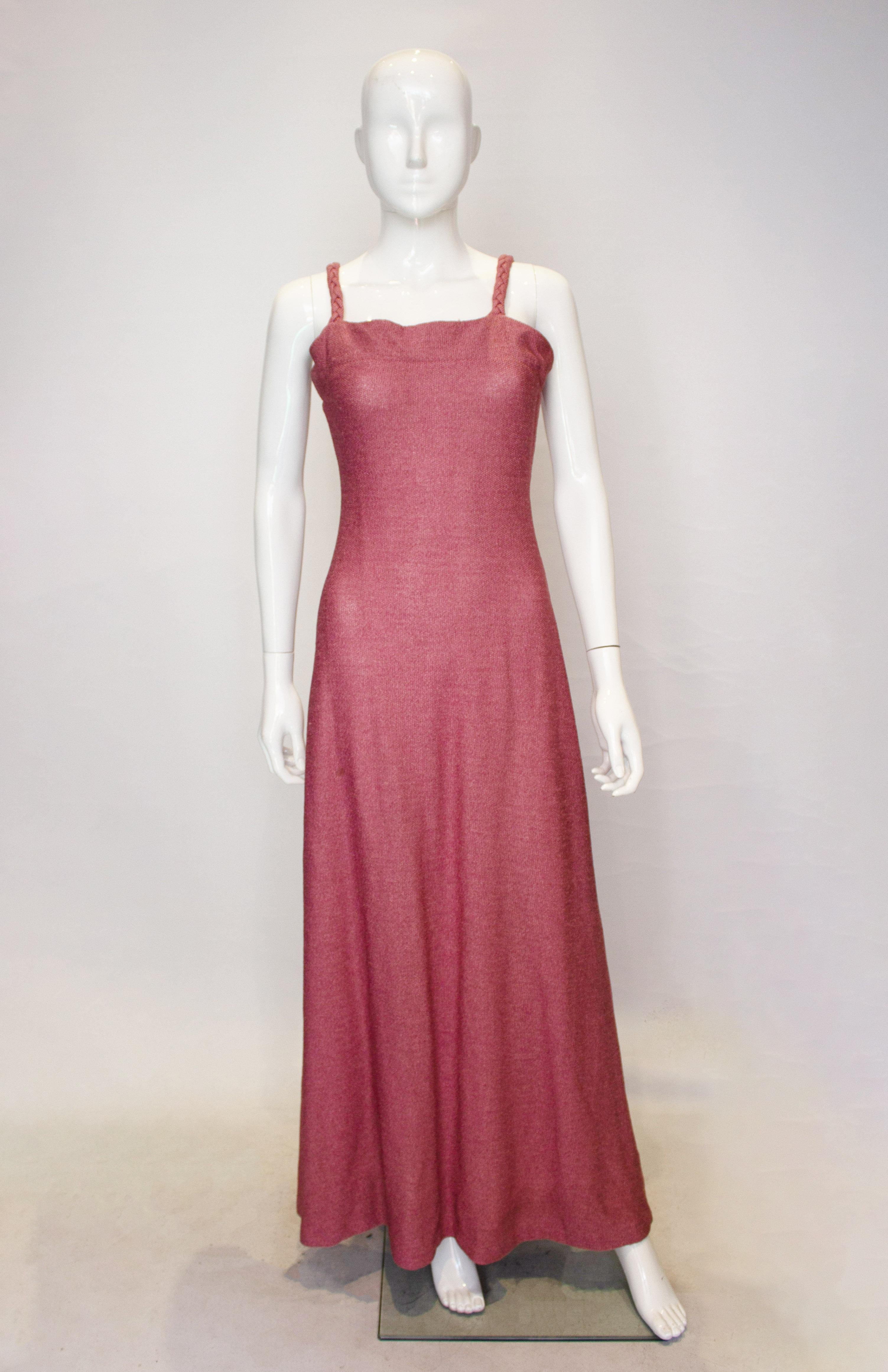 A pretty vintage dress in a raspberry pink knit. The dress has a central back zip, plaited shoulder straps and is A line. The fabric is quite a heavy knit and so hangs beautifully.