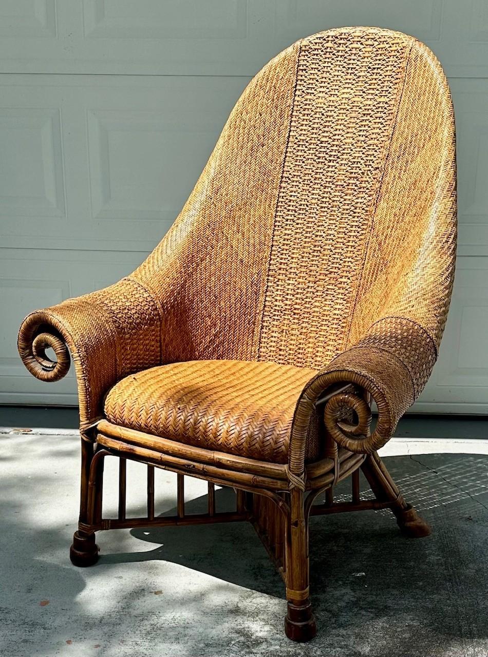 Vintage Rattan and Bamboo Armchair attr. To Ralph Lauren

Amazing wicker armchair, constructed from bamboo poles and covered with woven rattan in a geometric herringbone pattern. The comfortable seat has beautifully wide rolled and curved armrests