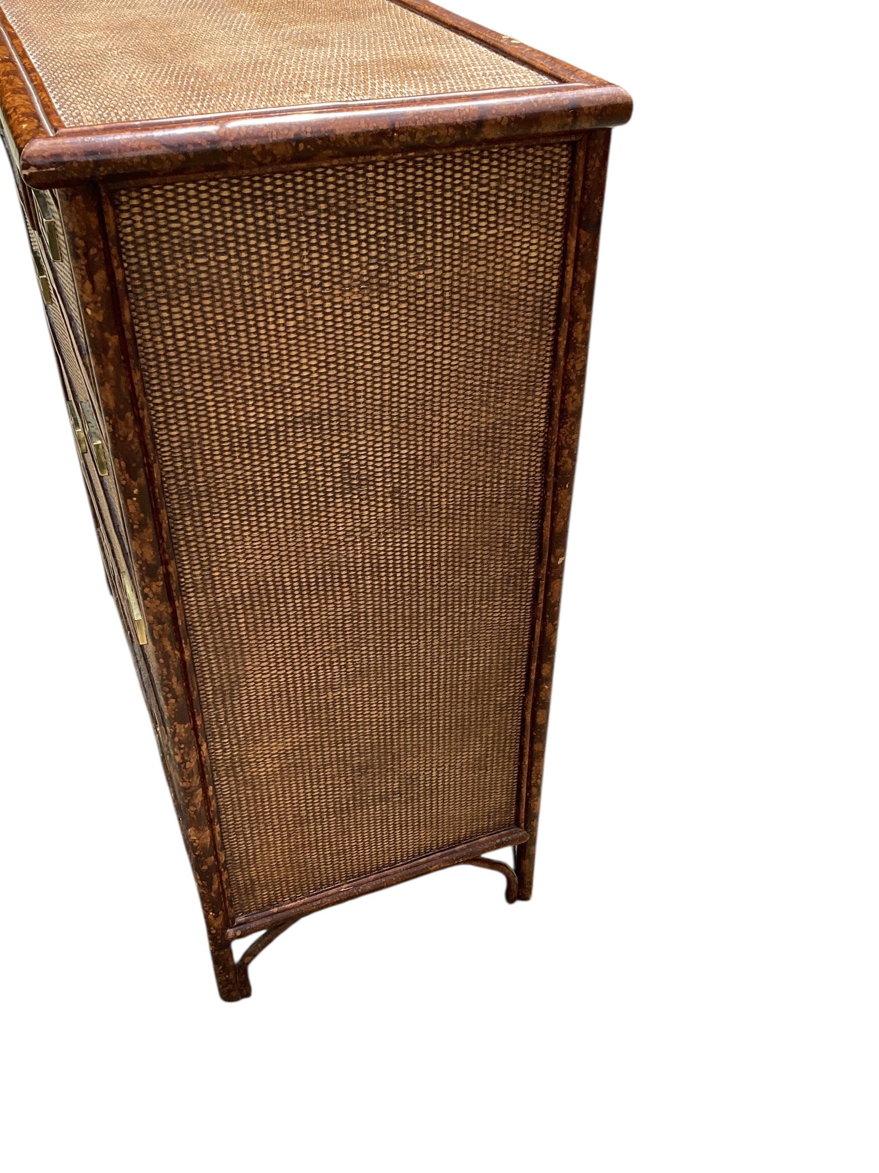 Vintage Rattan and Bamboo Chest of Drawers. Two over three drawer construction. Drawers move in and out freely. Chest is in good condition with expected wear.
Please contact us for cheaper shipping options.