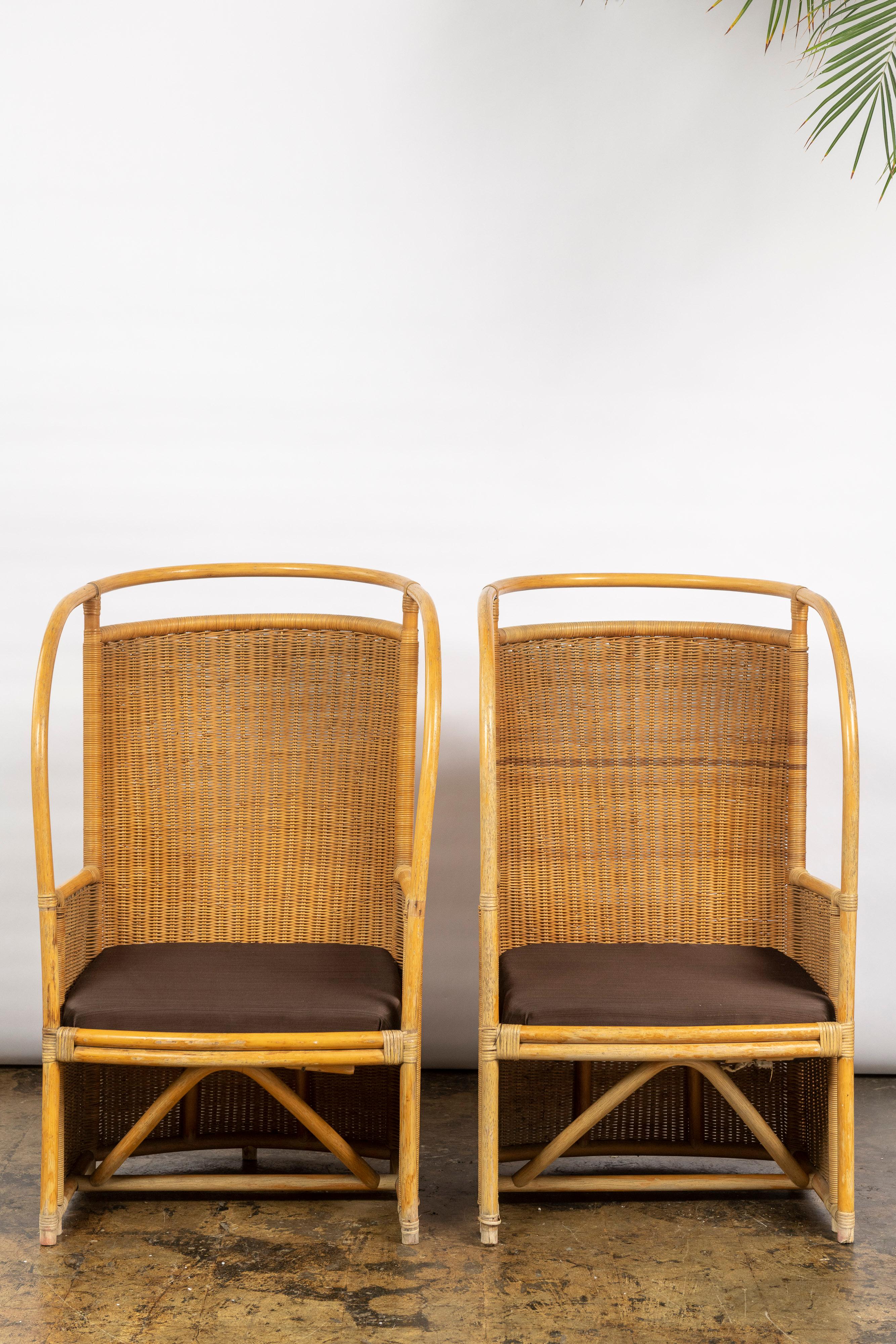 This is a wonderful pair of rattan and bamboo armchairs with a high back for placement on a porch, sunroom, or garden, made in Italy in the Mid-20th Century. Stylish and in very good condition.
