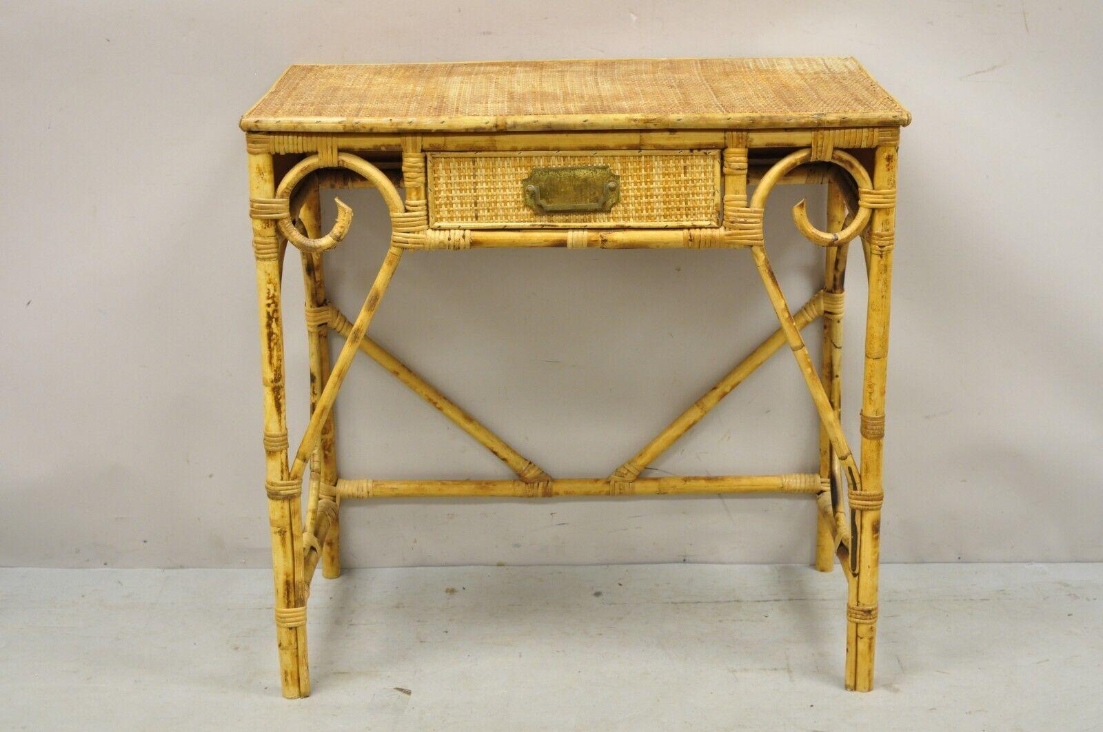 Vintage rattan and bamboo victorian style small vanity table desk with drawer. Item listed is a unique petite size, bent bamboo design, woven rattan top, 1 drawer, very nice vintage item, great style and form. Circa mid to late 20th century.