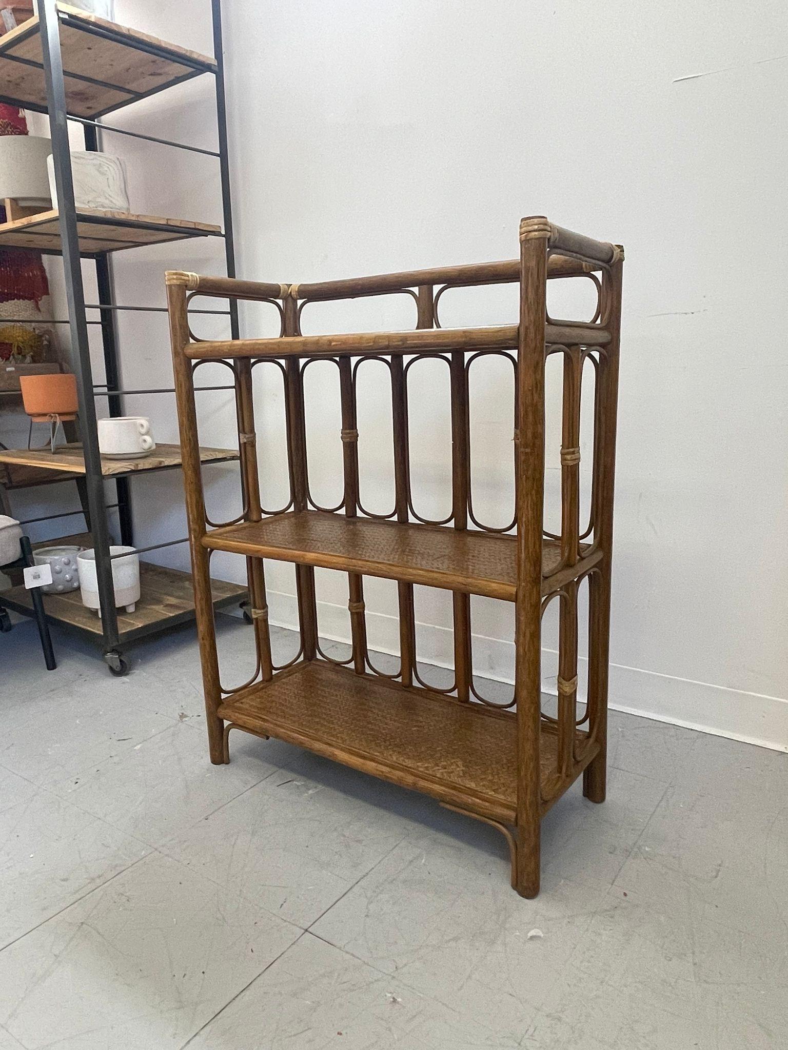 Retro Bookshelf with Woven wicker Shelves. Vintage Condition. Consistent with Age. Wear and Tear as Pictured ( online purchase only)

Dimensions. 26 W ; 11 D ; 35 H