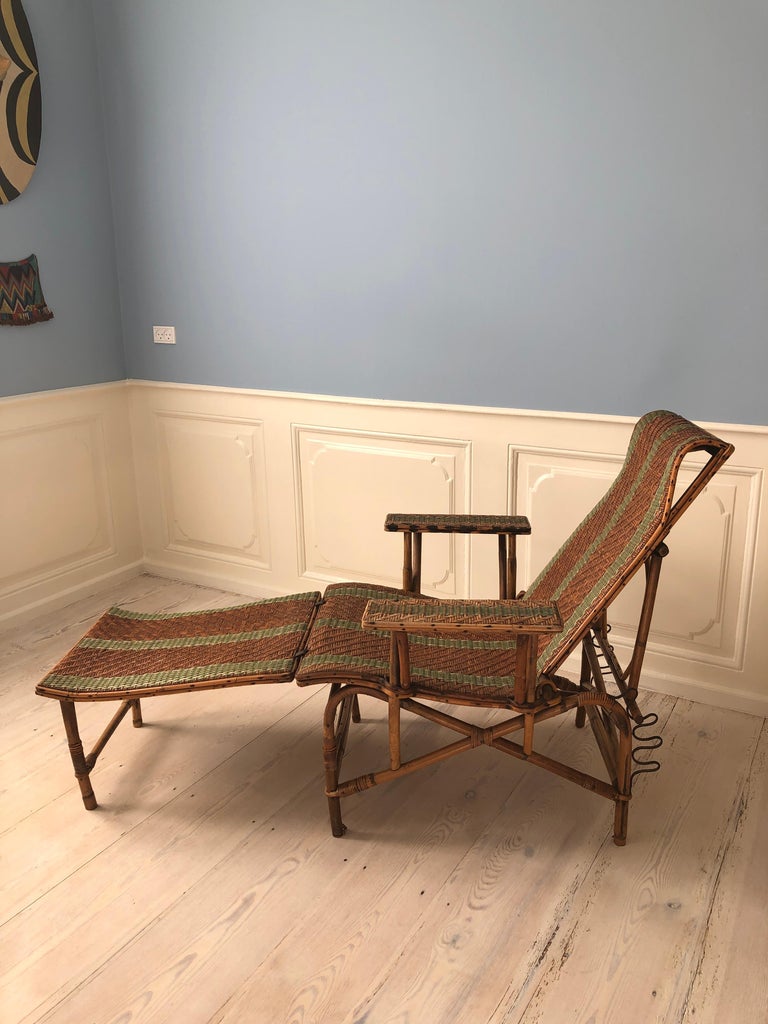 France, 1920's

Rattan armchair and footrest with green woven details.

Measures: H 90 x W 76 x D 170 cm.