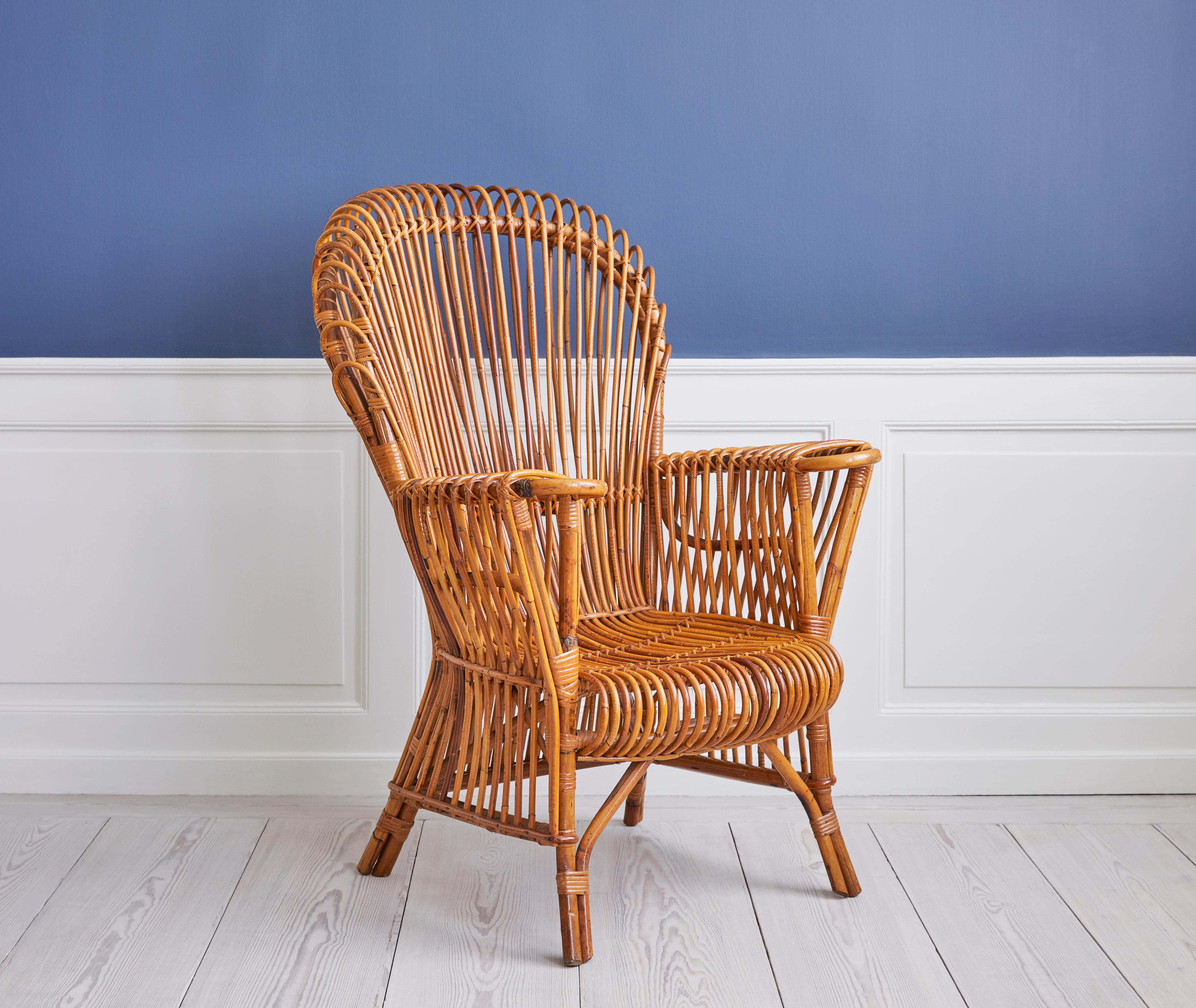Sturdy vintage rattan armchair made in Italy during the 1950s.