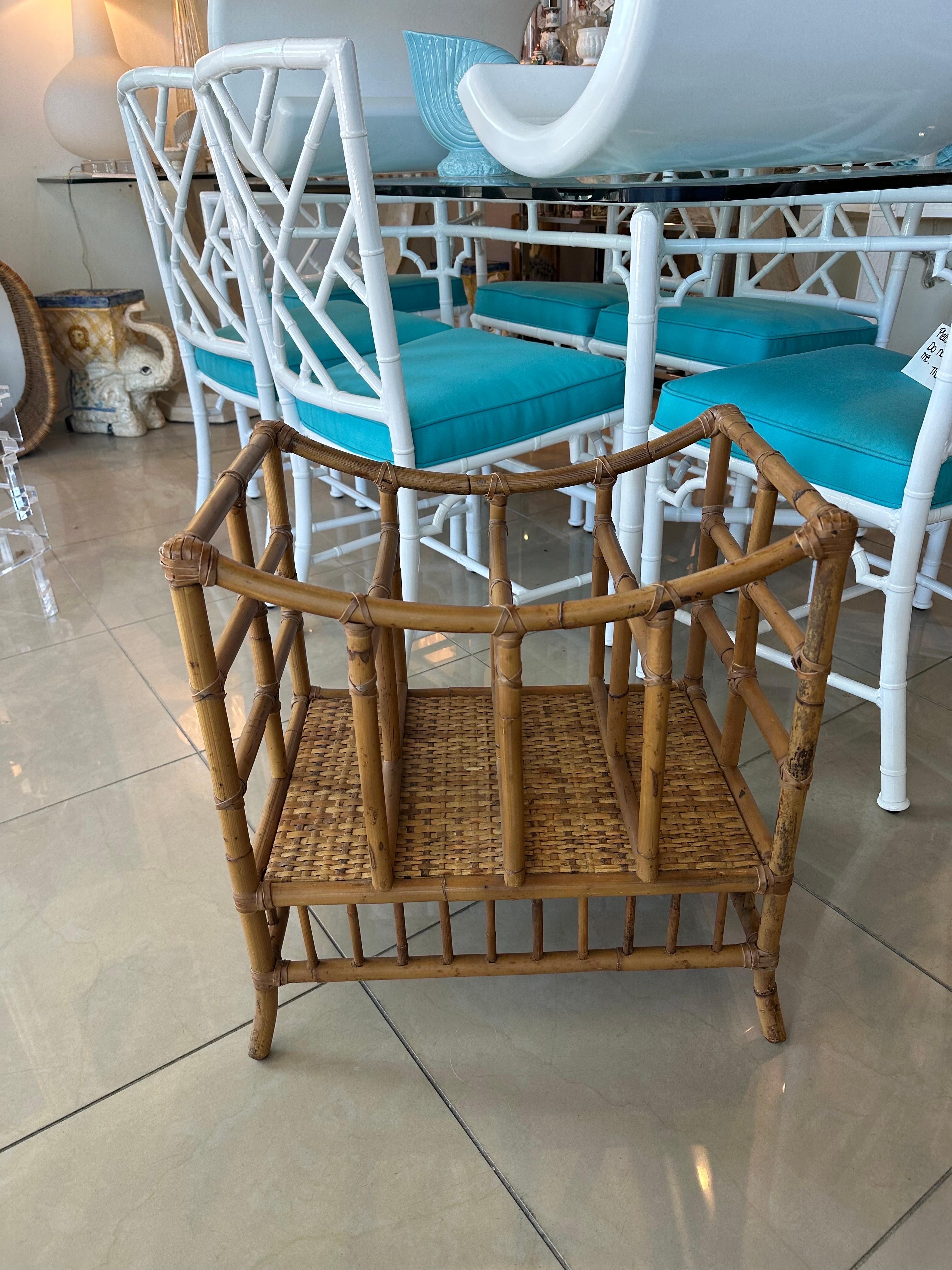 Vintage oversized large bamboo rattan magazine rack holder stand. Dimensions: 21 W x 15.5 D x 21.75 H. Original vintage rattan.