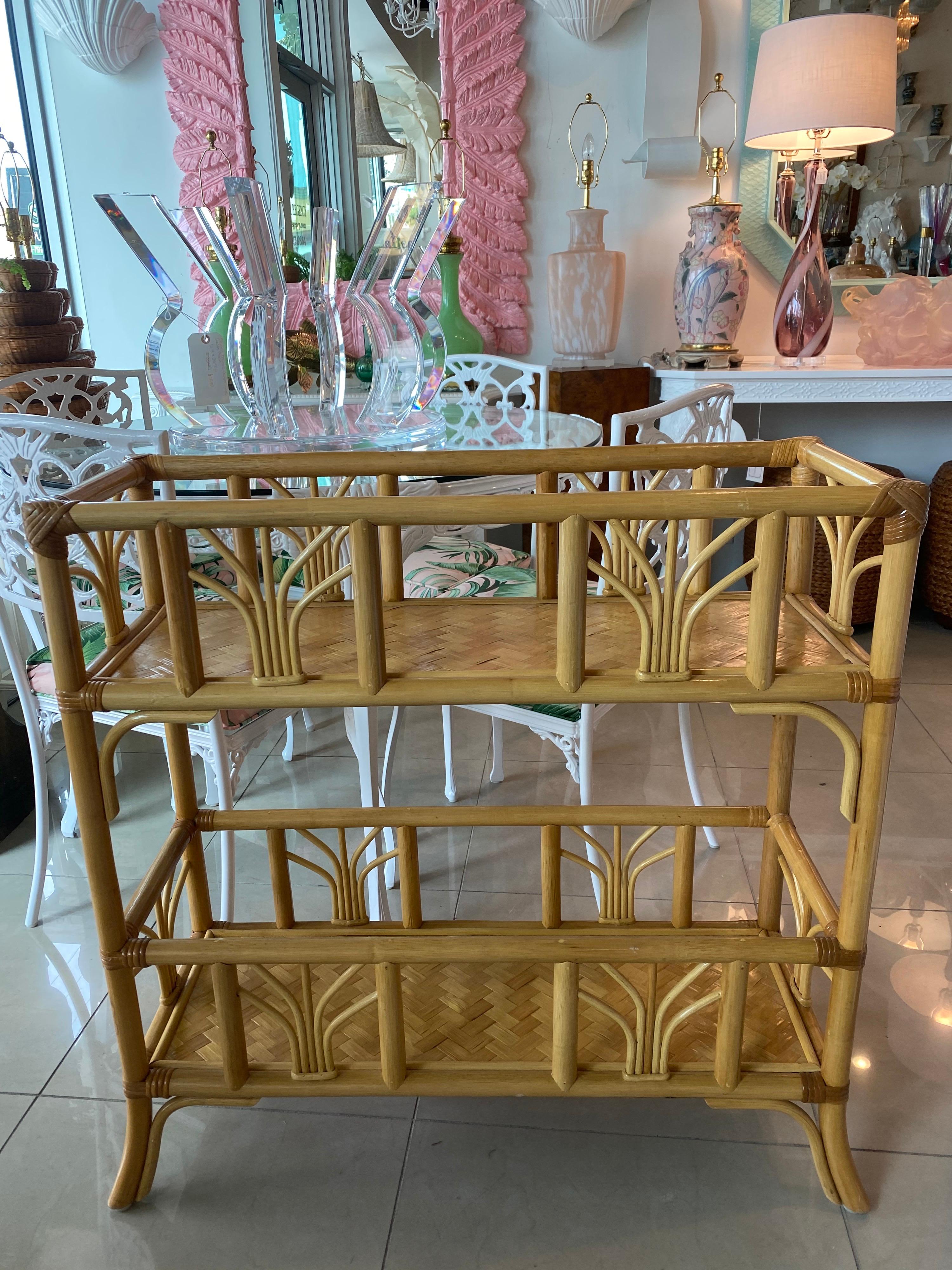 Lovely vintage rattan and bamboo plant stand, shelf, console table. This can be used for so many things! It can hold plants on either shelf, it can hold rolled up towels for a beach cabana (how cute!), You can put glass on the top and fill the top